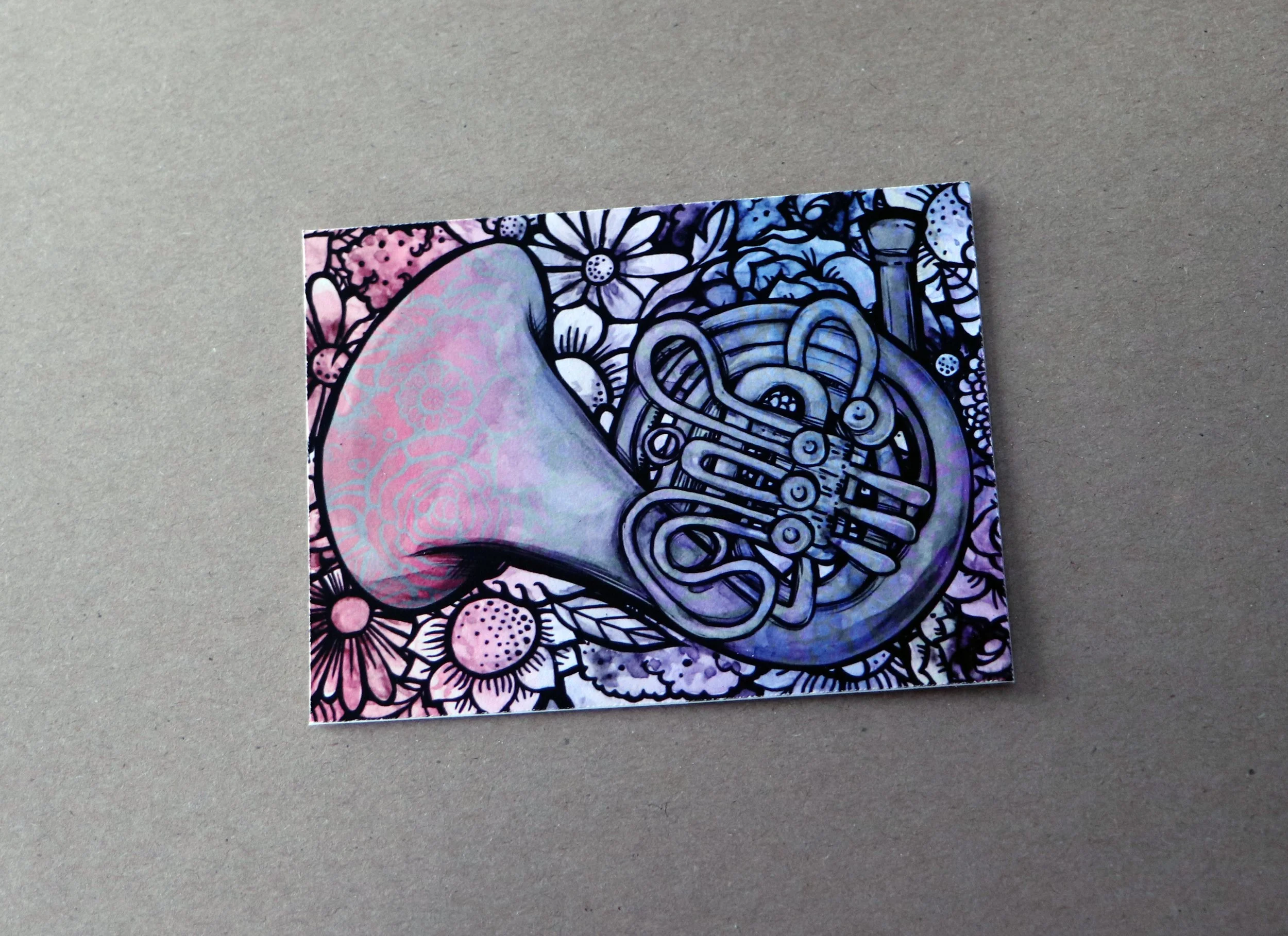 Artwork of a French horn with floral and abstract patterns in the background.