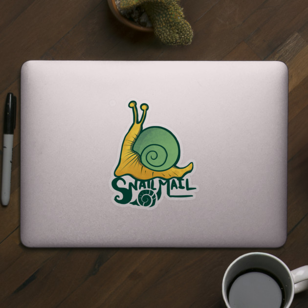 Laptop with a sticker of a snail and the words 'Snail Mail' on top of a wooden table, with a black marker, a potted cactus, and a cup of coffee nearby.