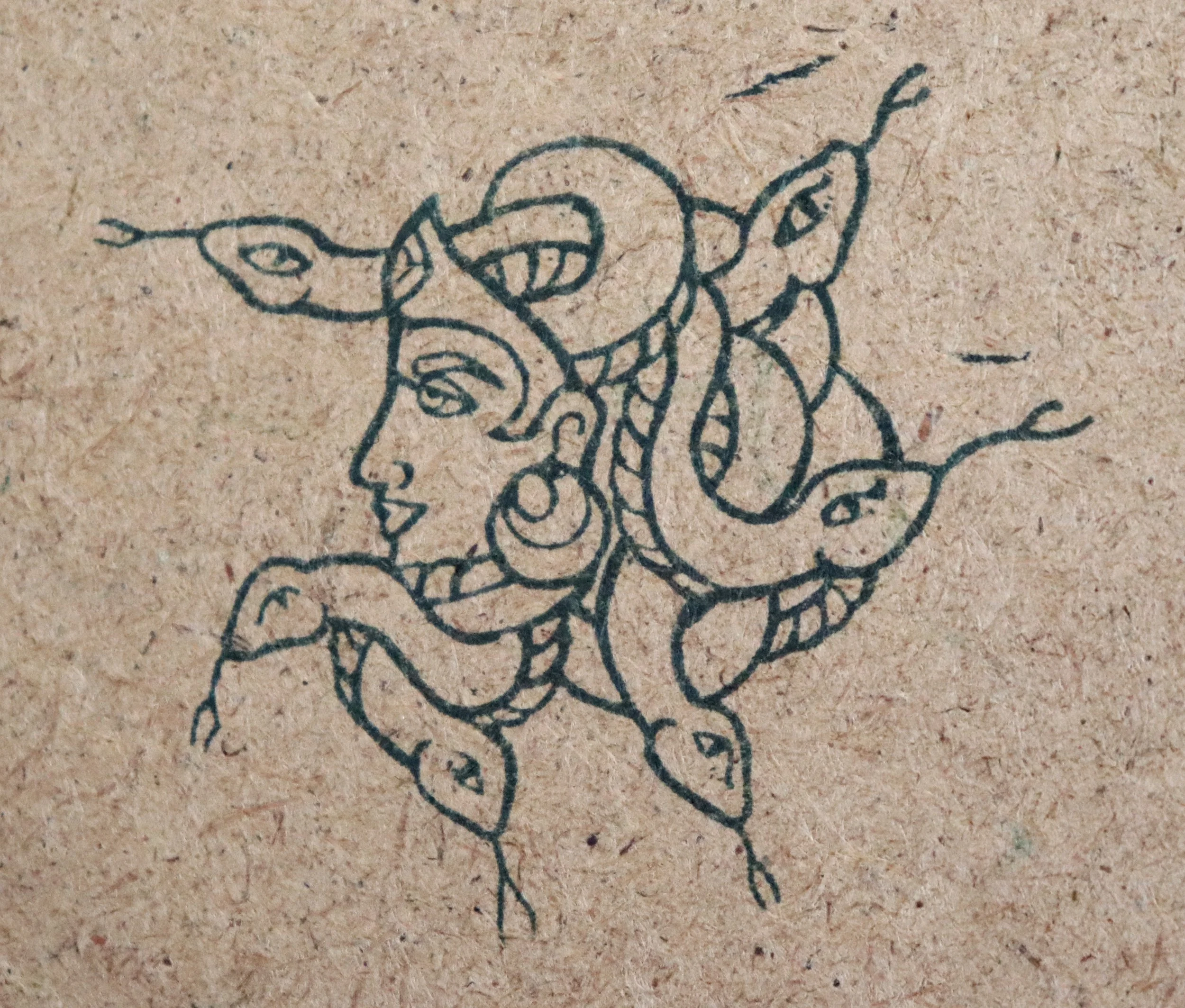 A black line drawing of a dinosaur on brown paper.