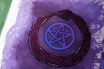 A purple pentagram symbol inside a circle, surrounded by a black snake on a purple background.