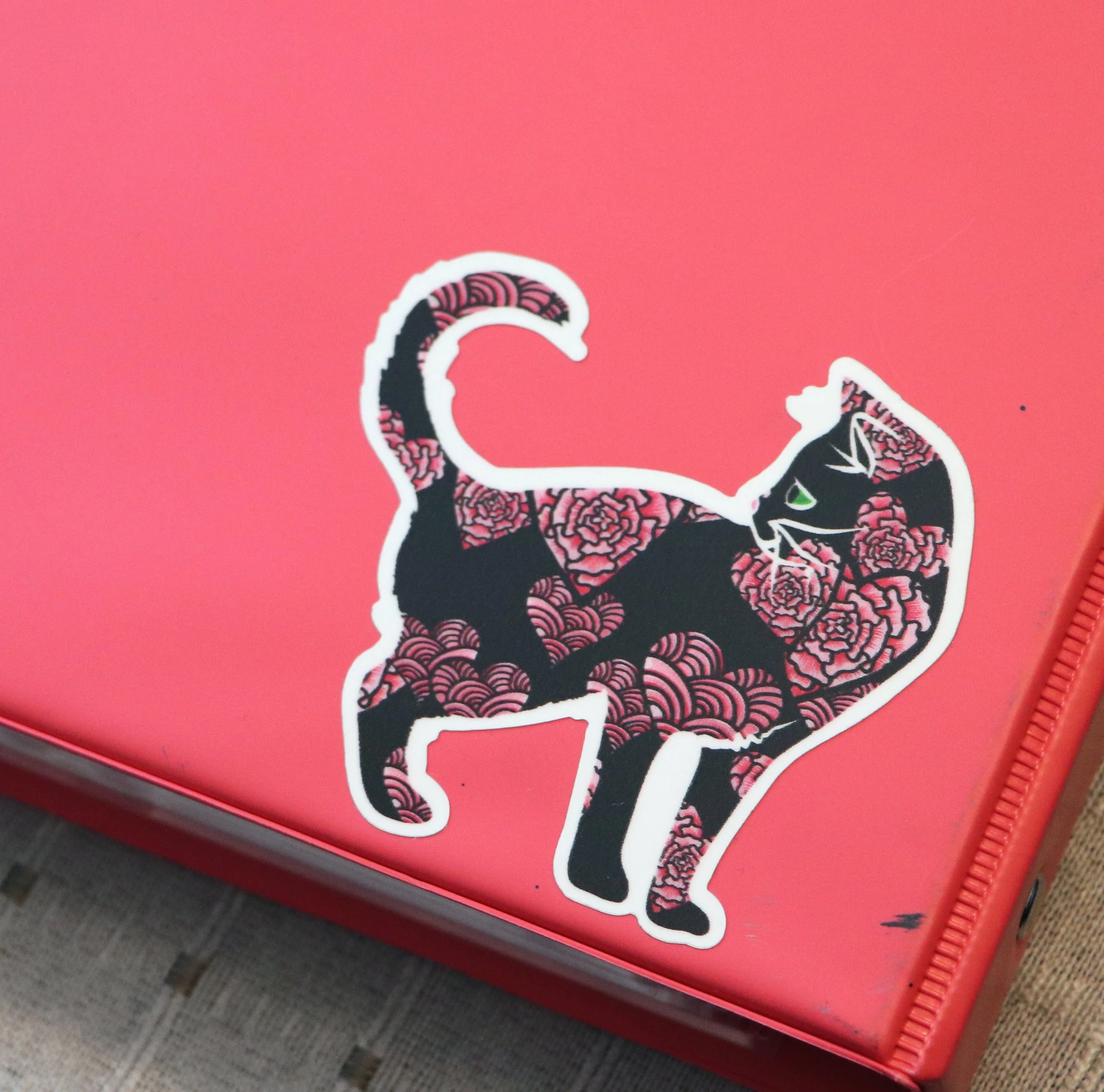  In a garden of blush-colored hue,
Two lovers pledged hearts so true.
With a kiss on the breeze,
And love’s gentle tease,
Their forever in bloom gently grew. Black Cat Sticker