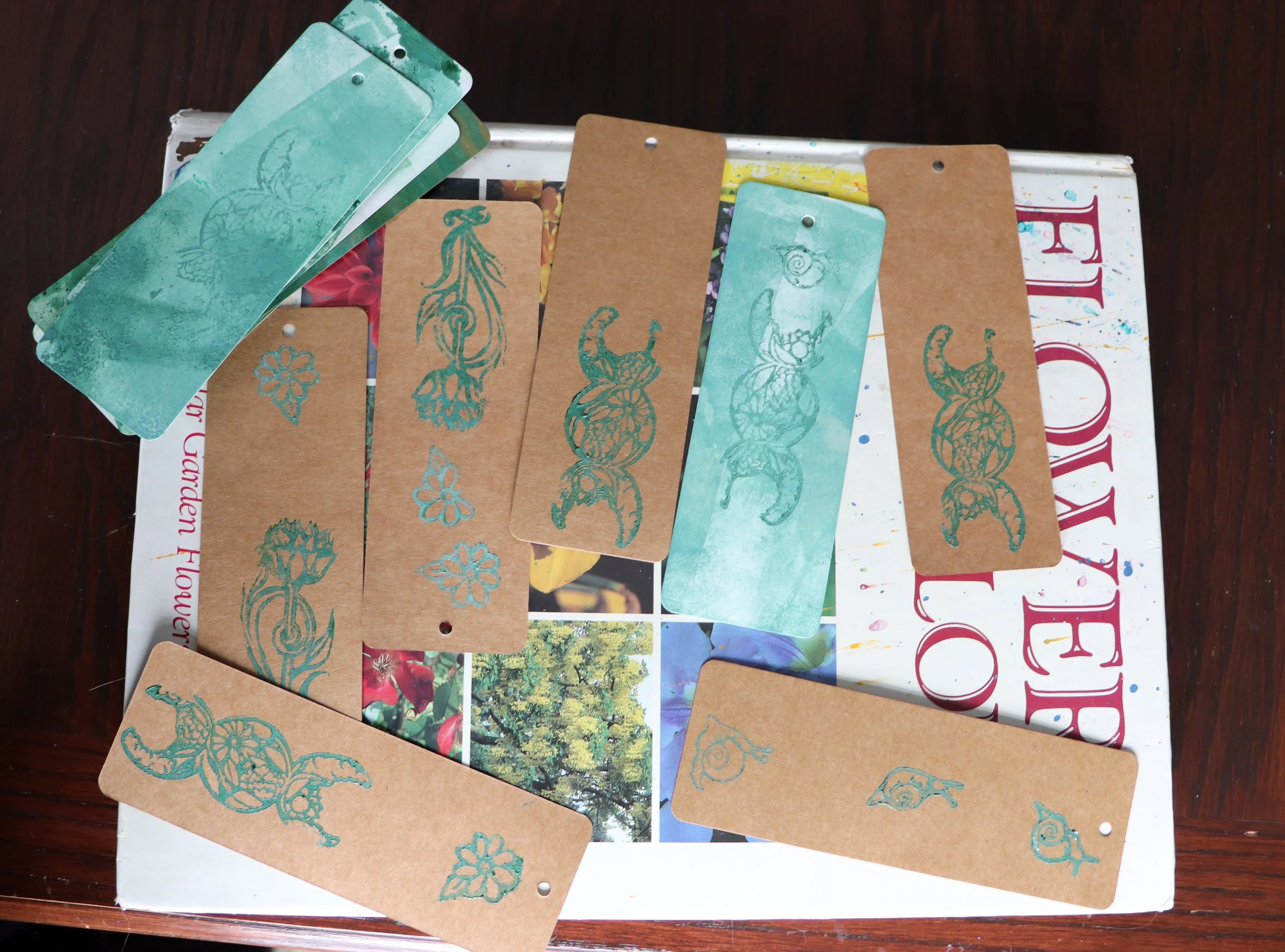 A board game setup with illustrated monster cards and landscape images.