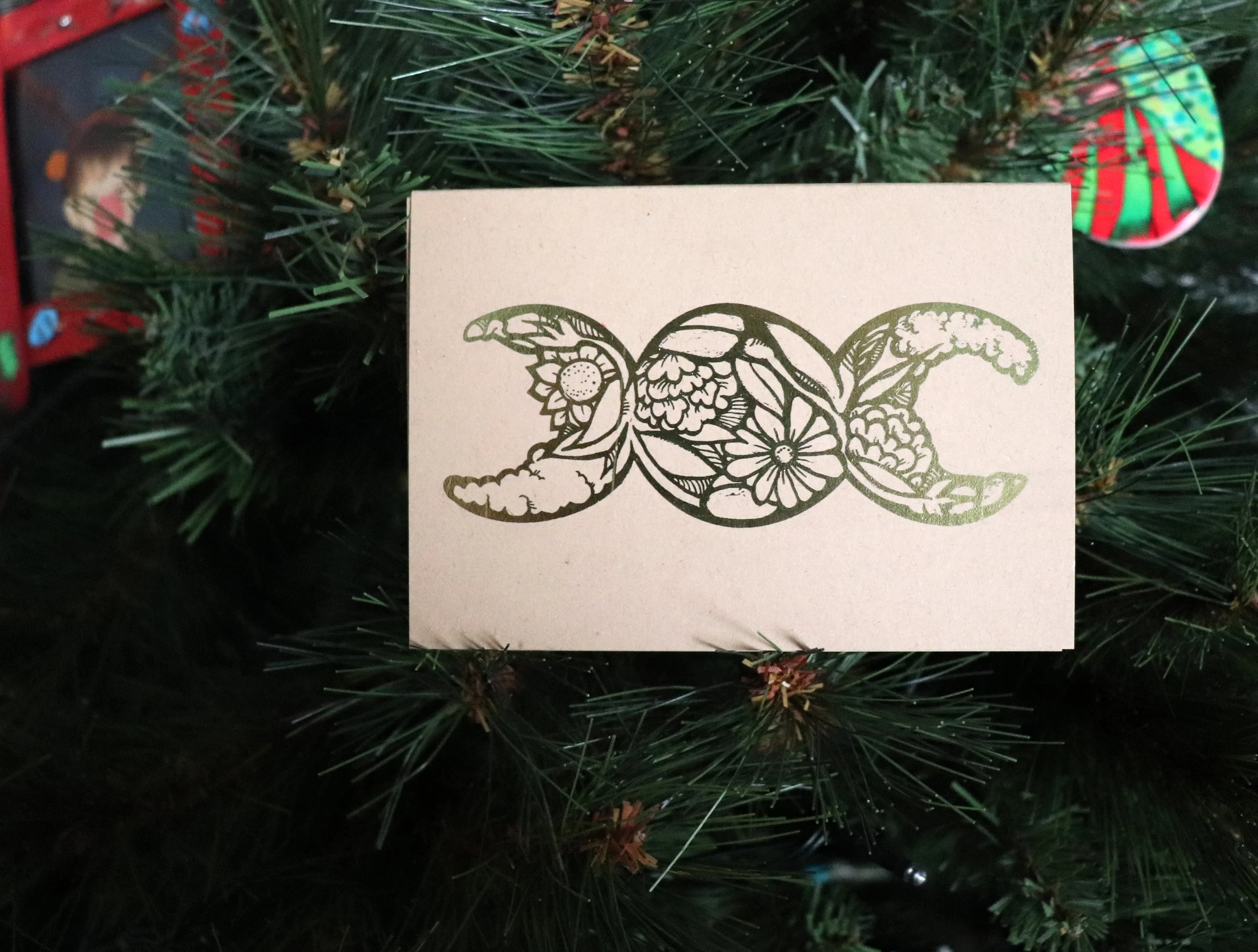 Celebrate the season with enchanting Yule cards featuring the Triple Moon symbol, a tribute to the goddess and the cycle of life. Adorned with blooming floral designs and luxurious gold gilding, these cards are perfect for honoring sacred rituals and