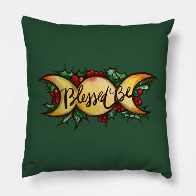 Green decorative pillow with a candy design and the words "Blessed" in black cursive writing.