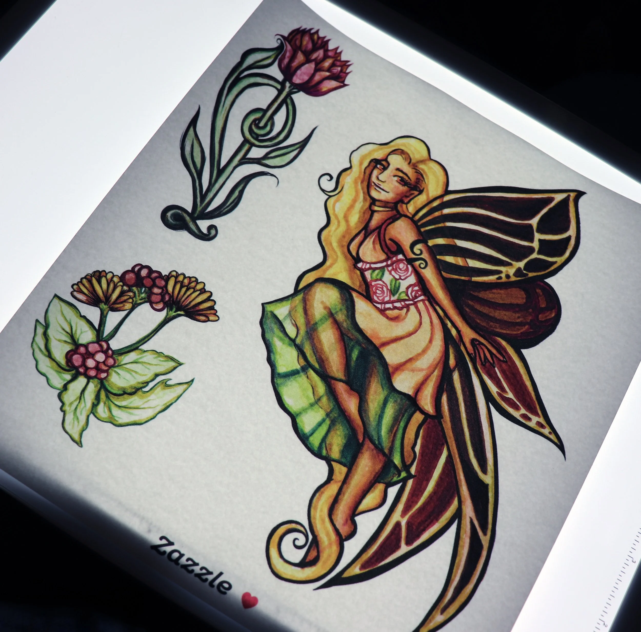 Colorful tattoo-style illustration featuring a fairy with butterfly wings, long curly blonde hair, a floral dress, sitting on a leaf, with two flowers and a lotus blossom surrounding her.