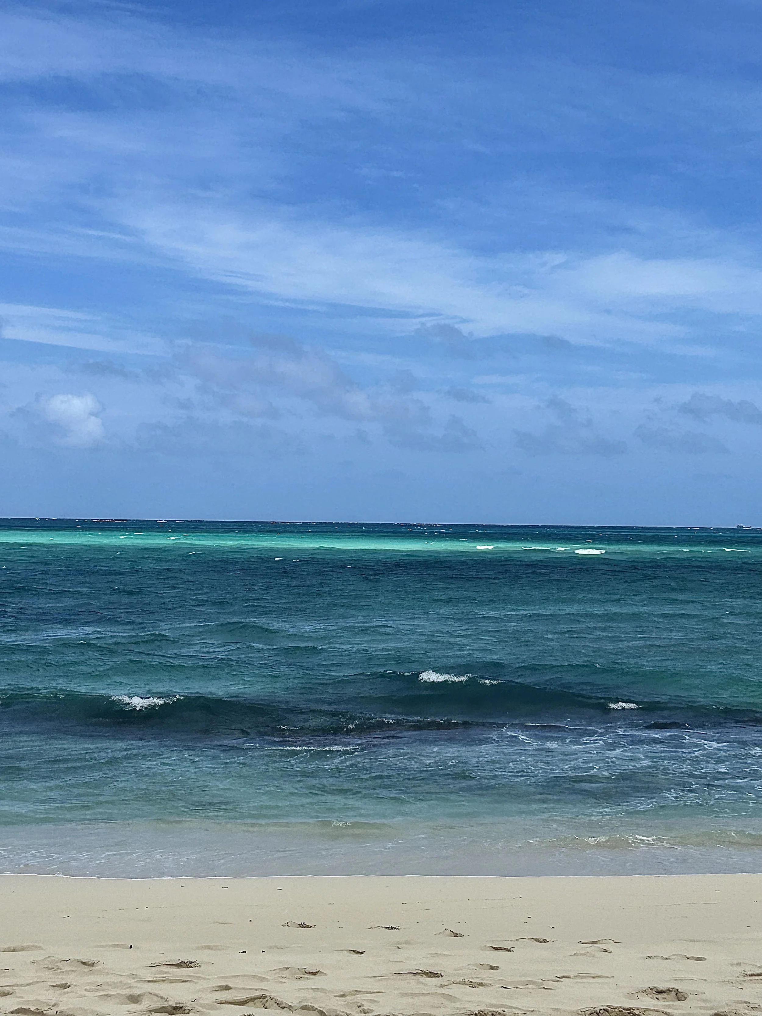 blue sky over turquoise water