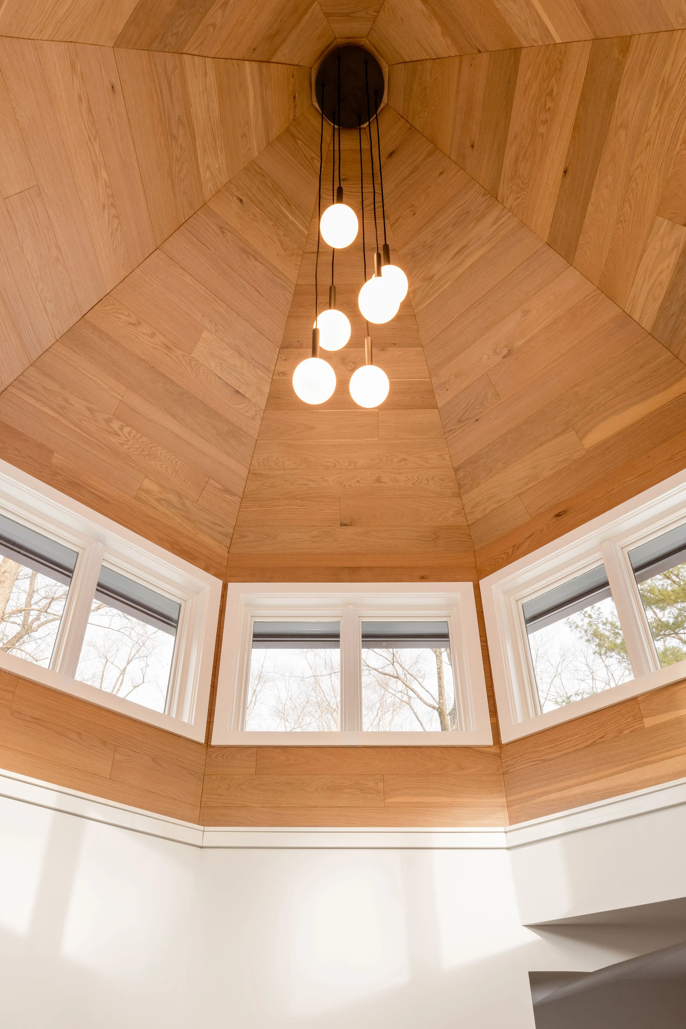 Clerestory windows and wood ceiling in modern turret