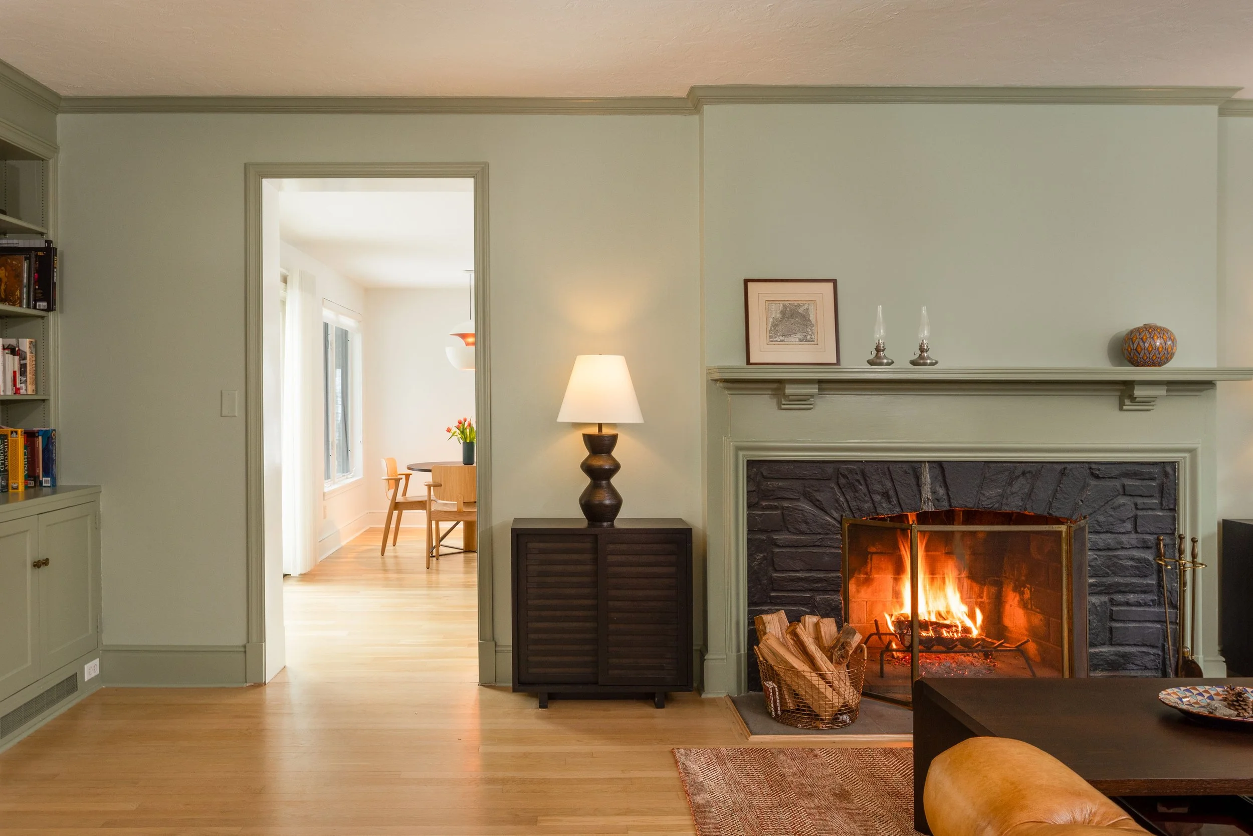 Colorful library with fireplace mixes traditional and modern design