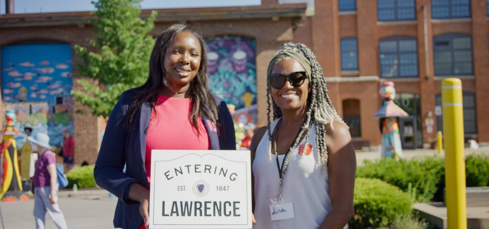 Eunice visiting Lawrence with an Entering Lawrence sign