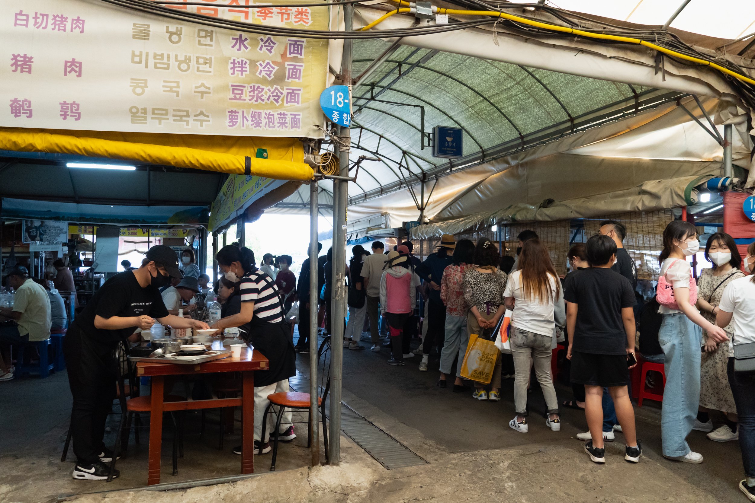  Queue to eat at a restaurant in the market 