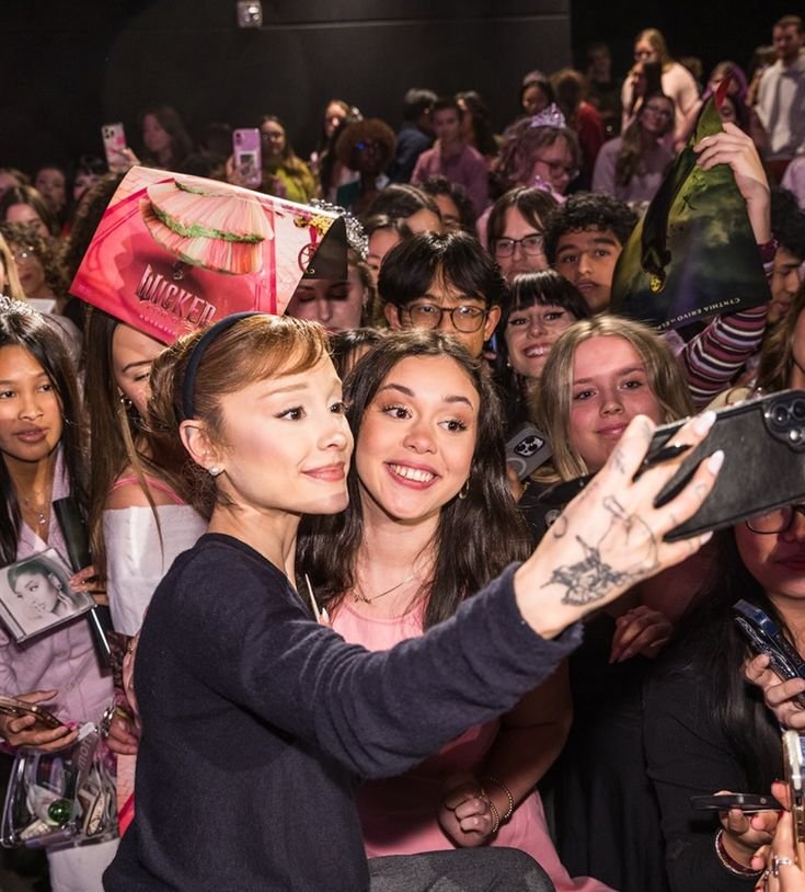 A fan with popstar Ariana Grande