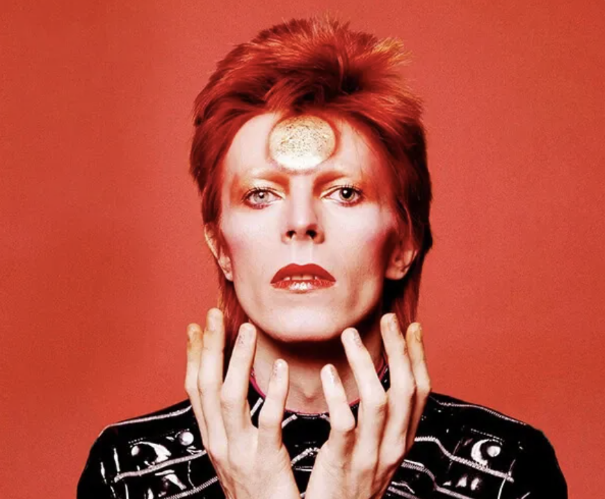 A headshot of David Bowie as Ziggy Stardust