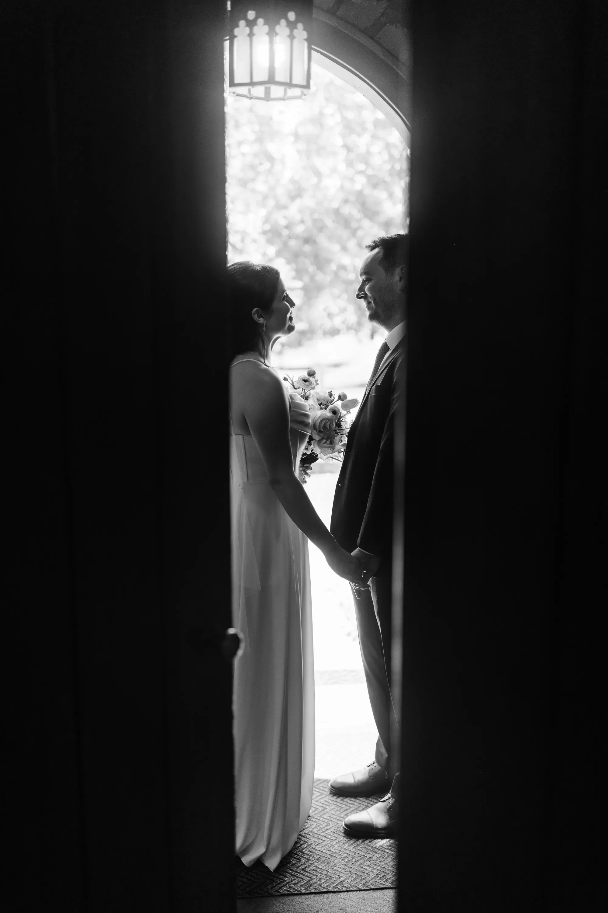 12-couple-framed-in-chapel-doorway-bw-pilgrim-chapel-kansas-city.webp