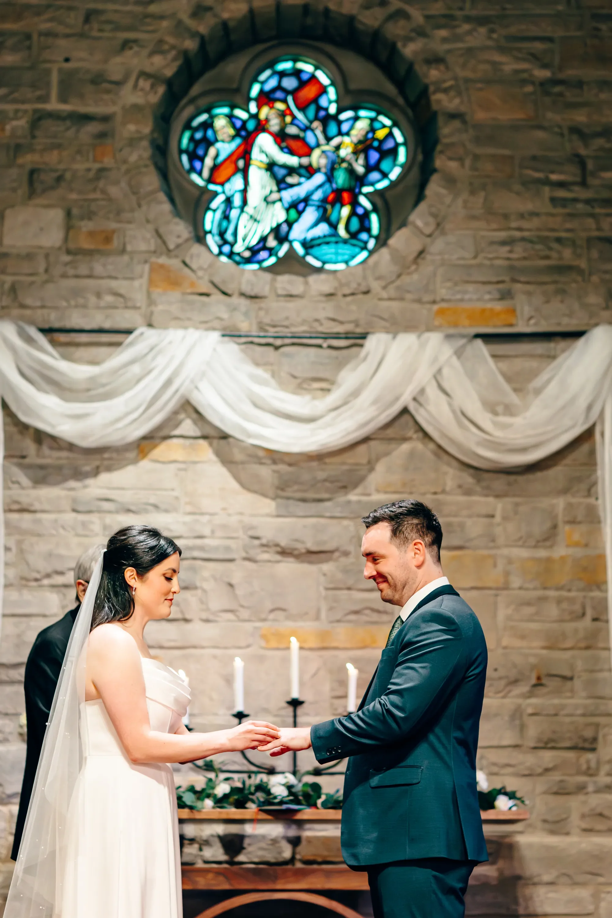 17-ring-exchange-beneath-rose-window-pilgrim-chapel-kansas-city.webp