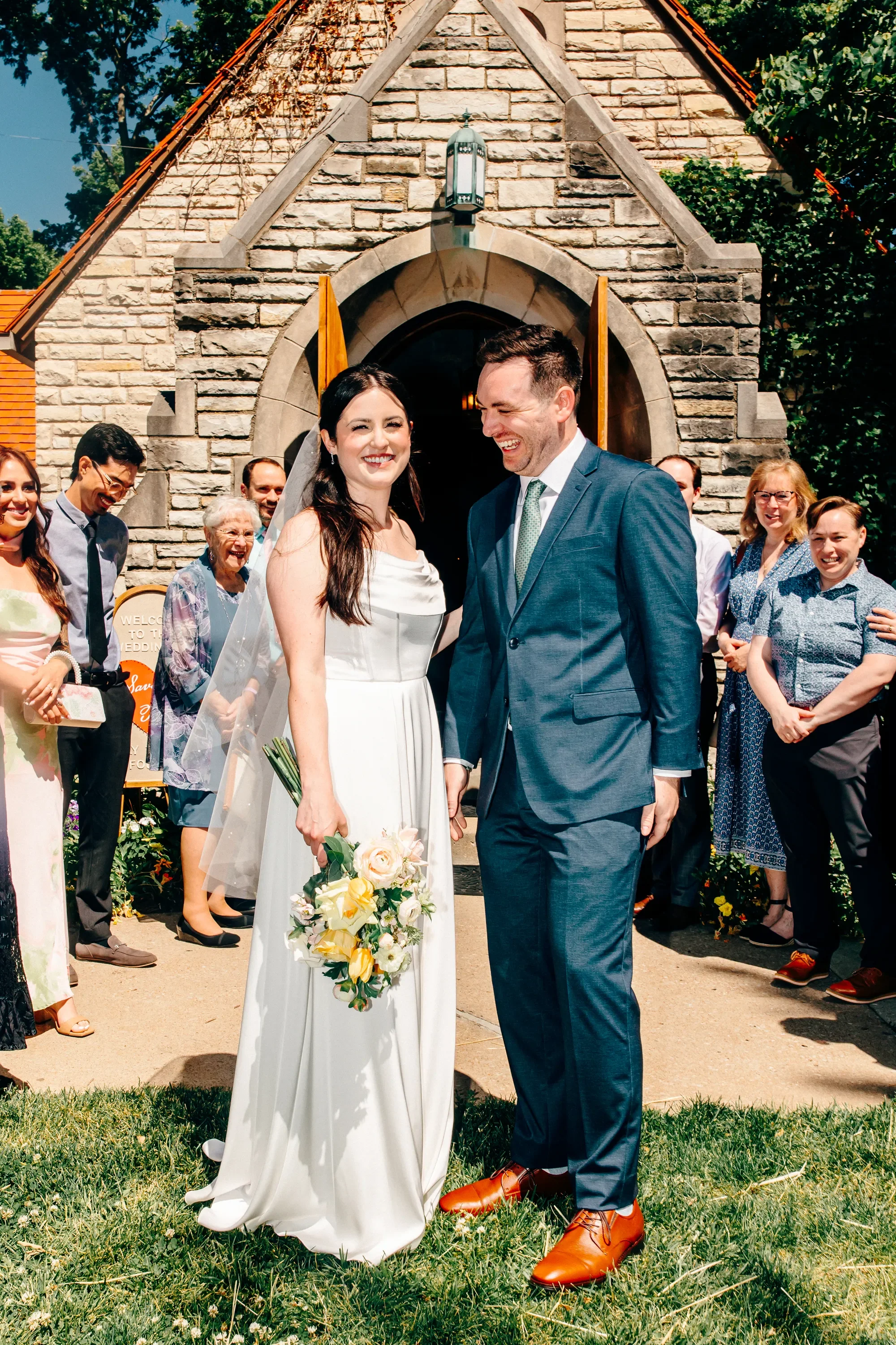 24-chapel-exit-couple-laughing-pilgrim-chapel-kansas-city.webp