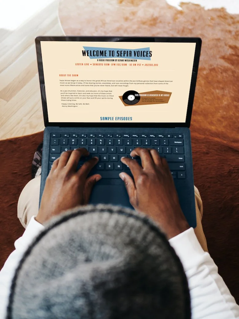 Person using a laptop with a webpage titled 'Welcome to Sepia Voices' open on the screen, focusing on a radio program about African American jazz and blues music.