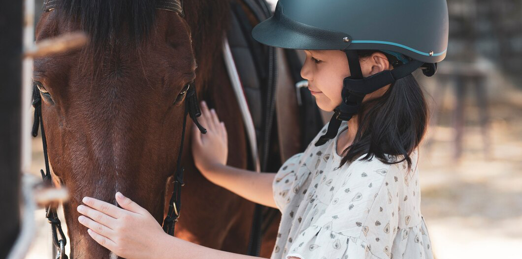Jennifer Field Foundation-Girl Petting Horse.png