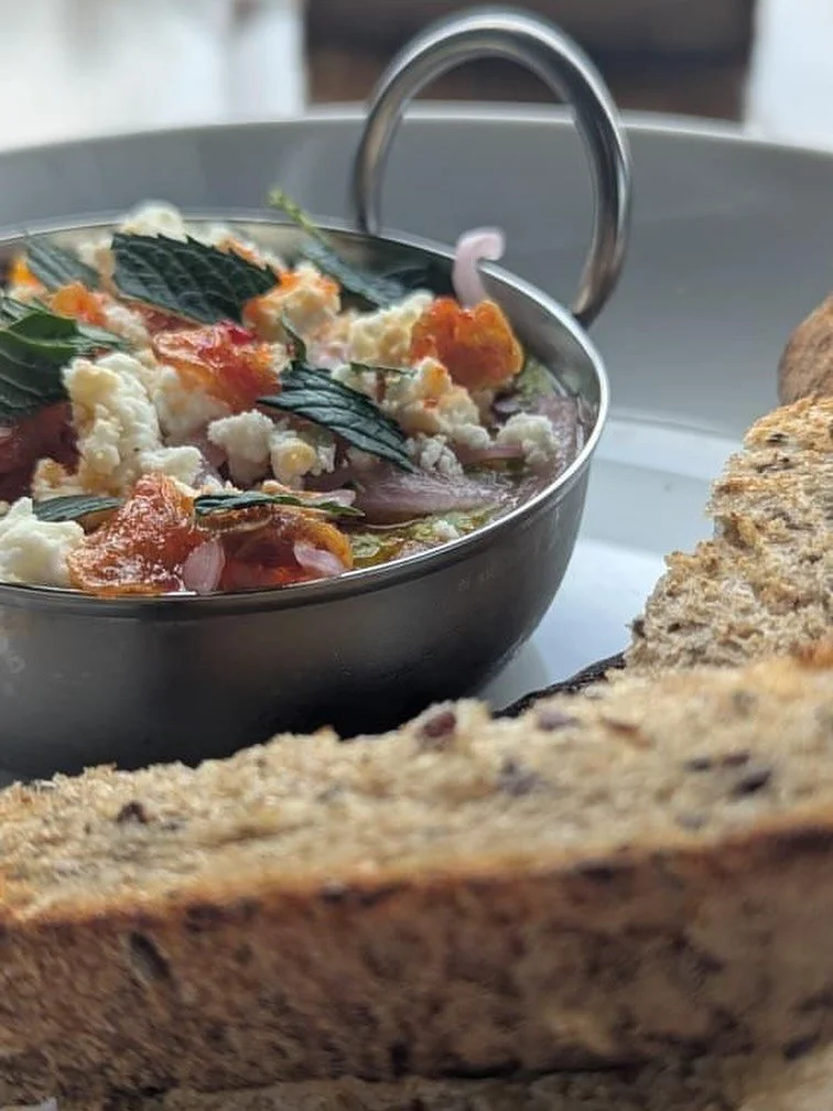 HEY @fluidvoyage  MADE A FUN SPECIAL FOR YOU ALL 

Garlicky Pea Dip, Feta, Pickled Onion, Garlic-Lemon-Chili Oil, and Mint.  Served with sourdough porridge bread.