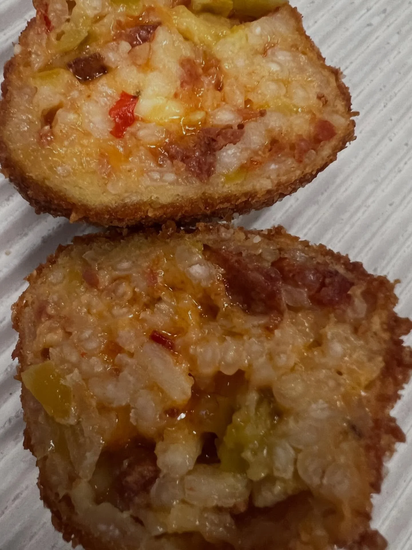 BALL DROP. Can you guess which of our pizzas was @fluidvoyage&rsquo;s inspiration for this arancini? 

The Pepperoni Bomb 
Chopped pepperoni, pepperoncini, red onion, feta, Calabrian chili and served with hot honey 

&ldquo;arancini