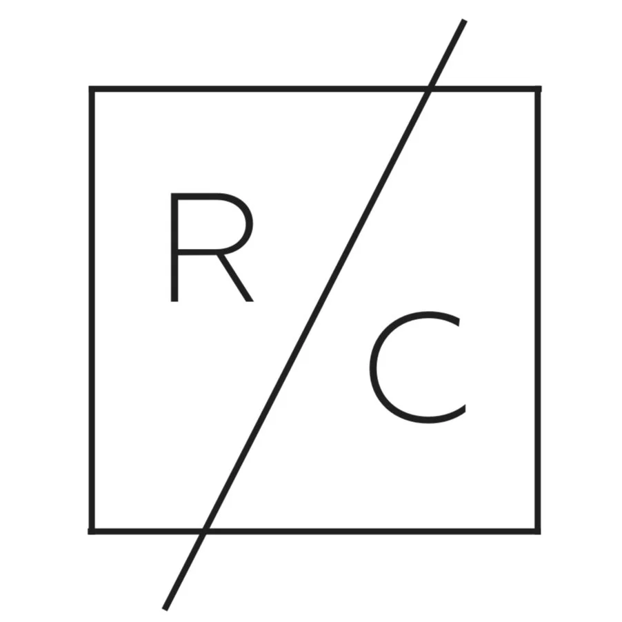 A black and white graphic of a square divided diagonally, with the letters R and C on either side of the diagonal line.
