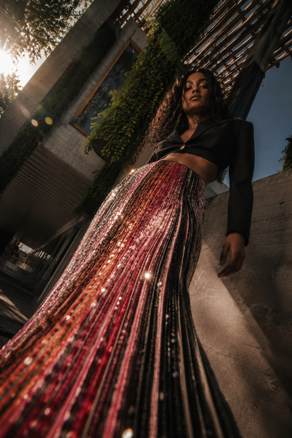 THE OUTNET AI fashion campaign in São Paulo created by Alessia Moccia, featuring a woman in a sequined skirt against modernist architecture.