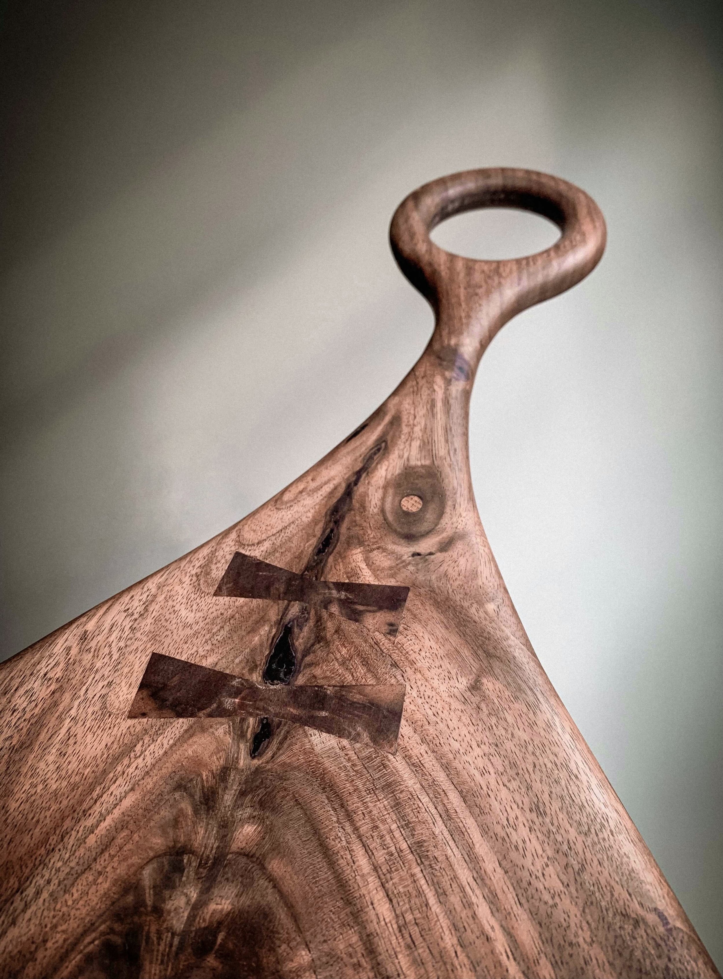 Loop Style Handle with Two Bow Tie Inlays Stitches and Oak Dowel Plugs Throughout 