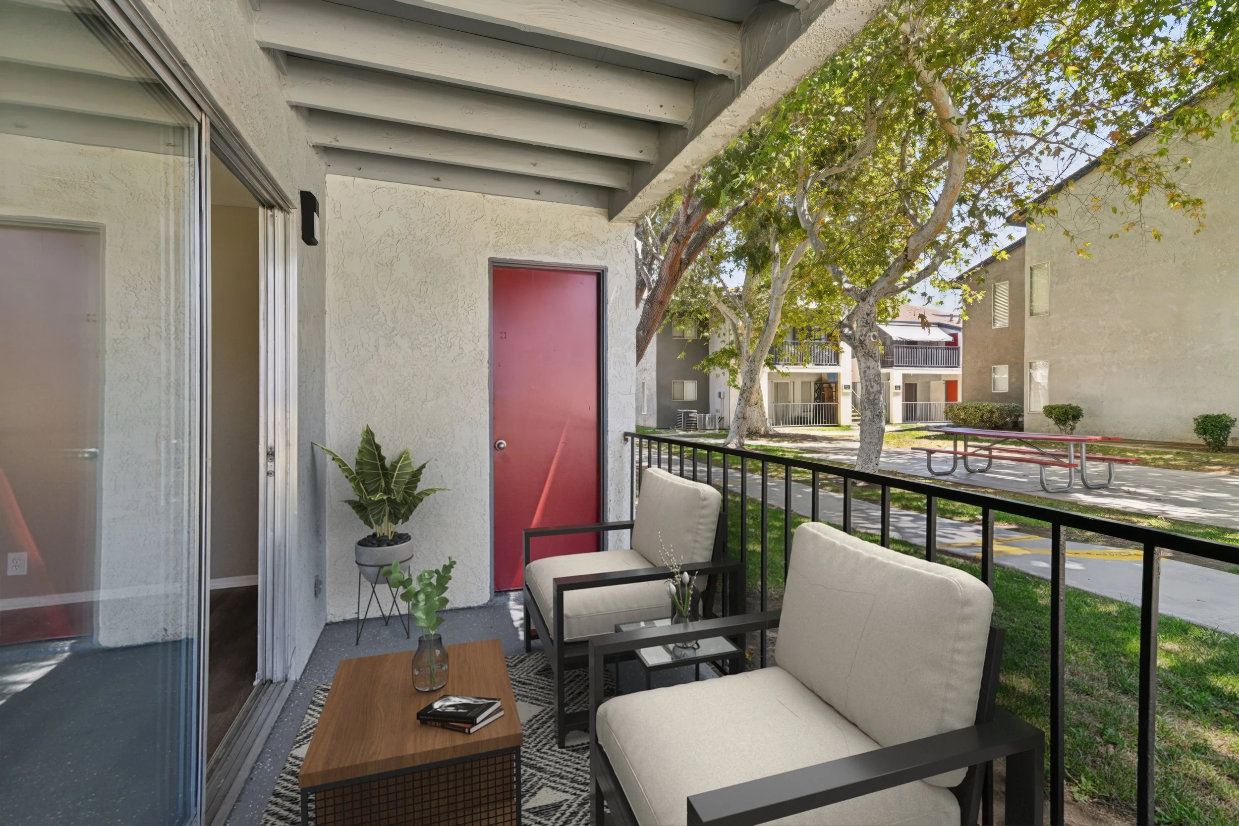 The patio area in the 2x2 unit. A great space to get some fresh air. Surrounded by trees & plants. 
