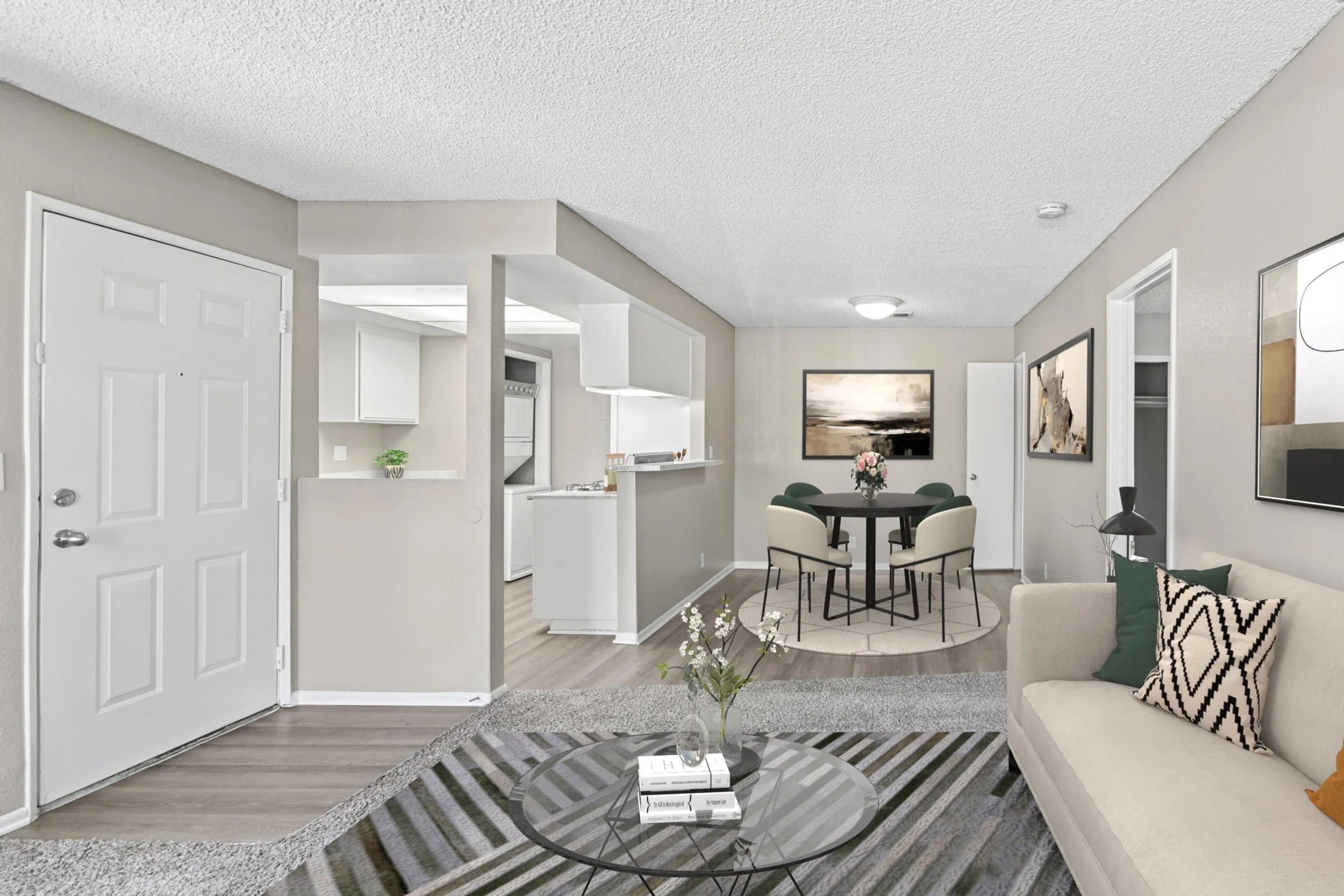 This image shows a 1x1 unit taken from the living room. Facing the dining room & kitchen.