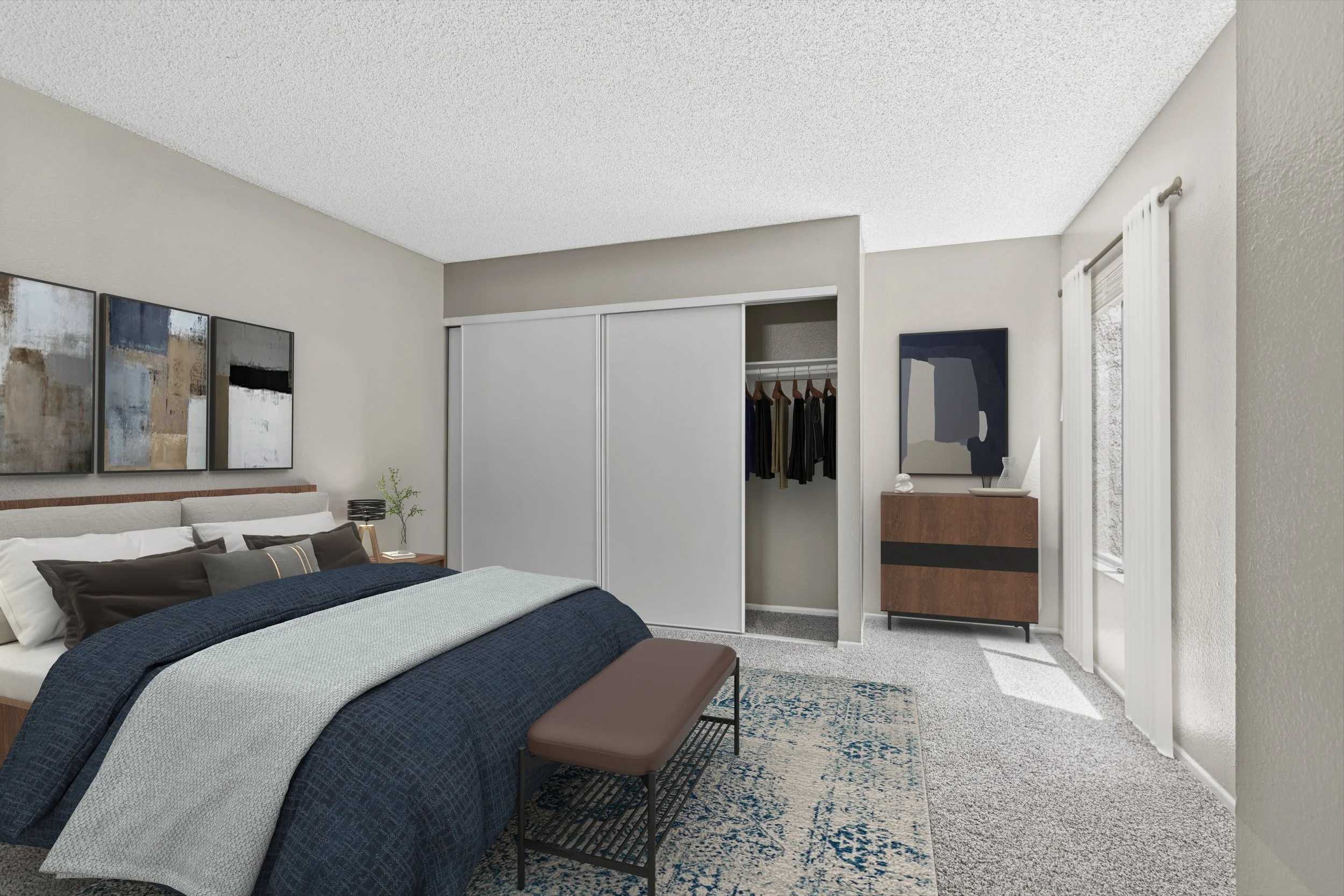 Our 2x2 unit primary bedroom. Has lots of closet space & the perfect nook for a dresser or desk space. 