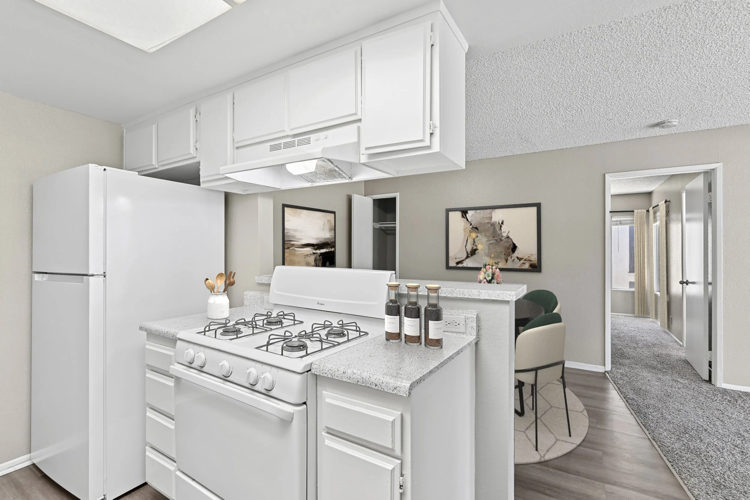 A sleek white kitchen in our 1x1 unit.