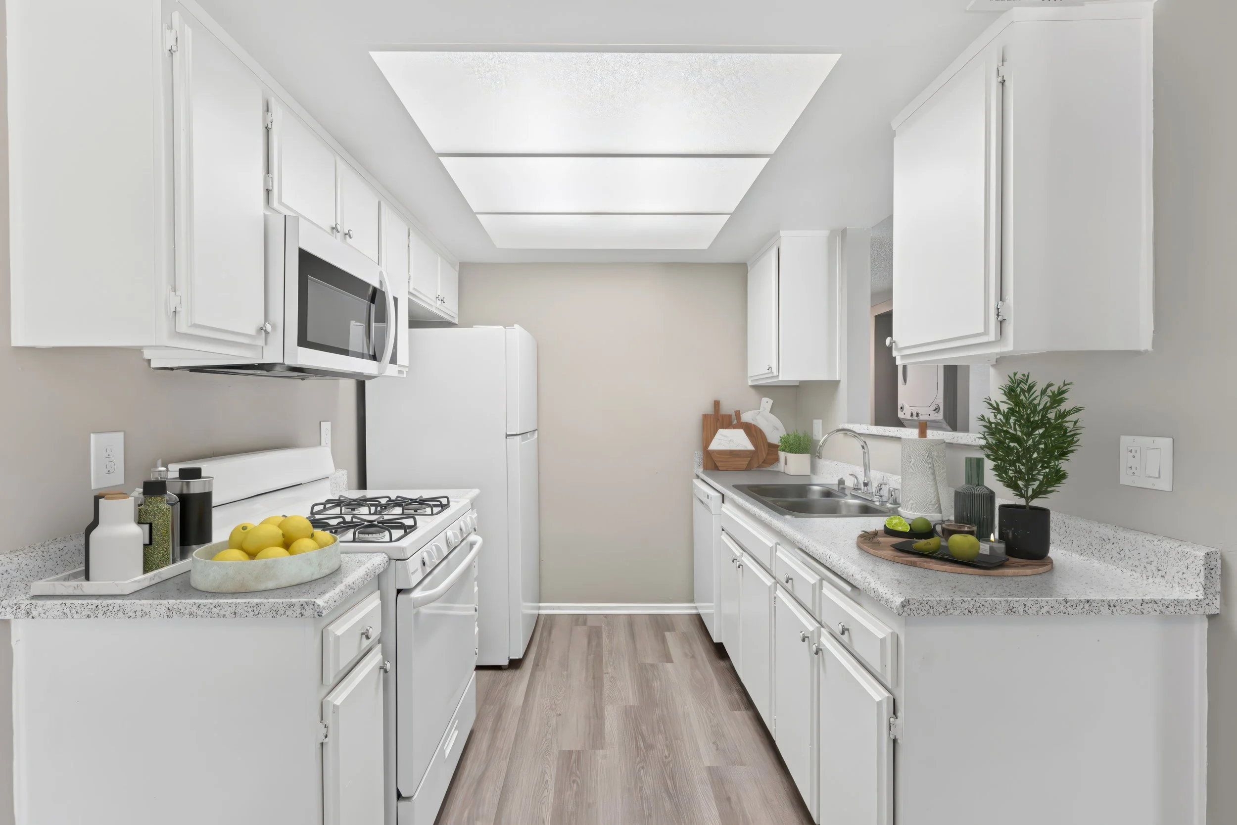 Our sleek, fully equipped kitchen in the 2x2 unit. The perfect amount of counter space for your cooking needs. 