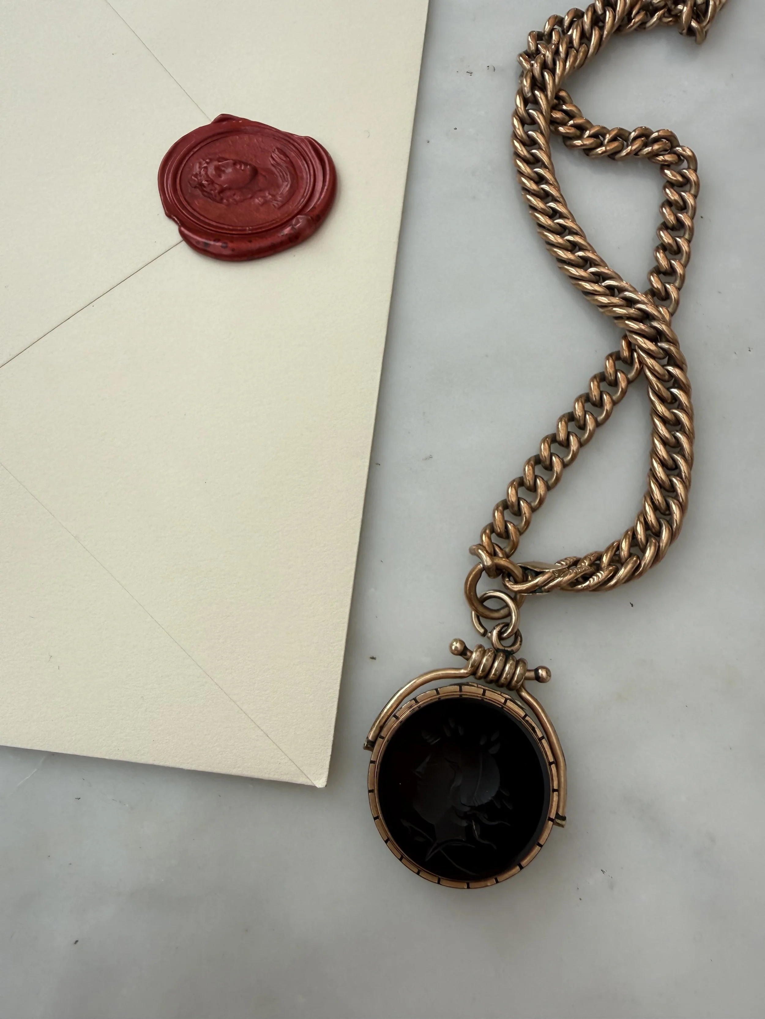 19th century agate intaglio double-sided locket with curb chain pairing