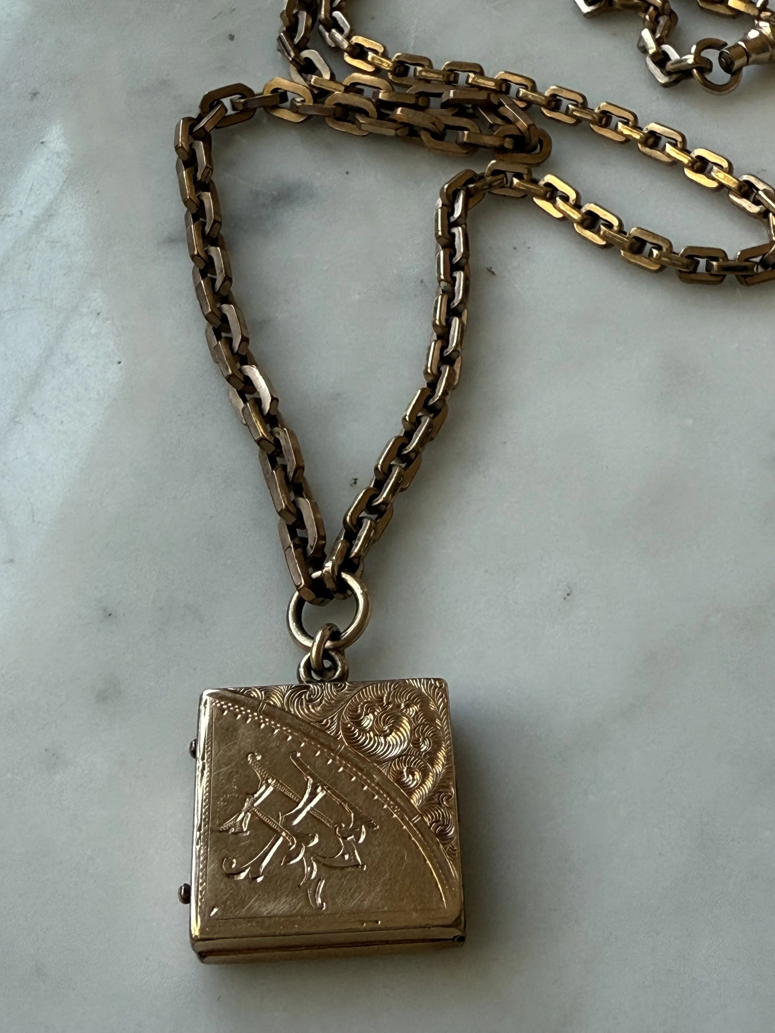 Late 19th century etched locket with 20th century rectangular link chain pair