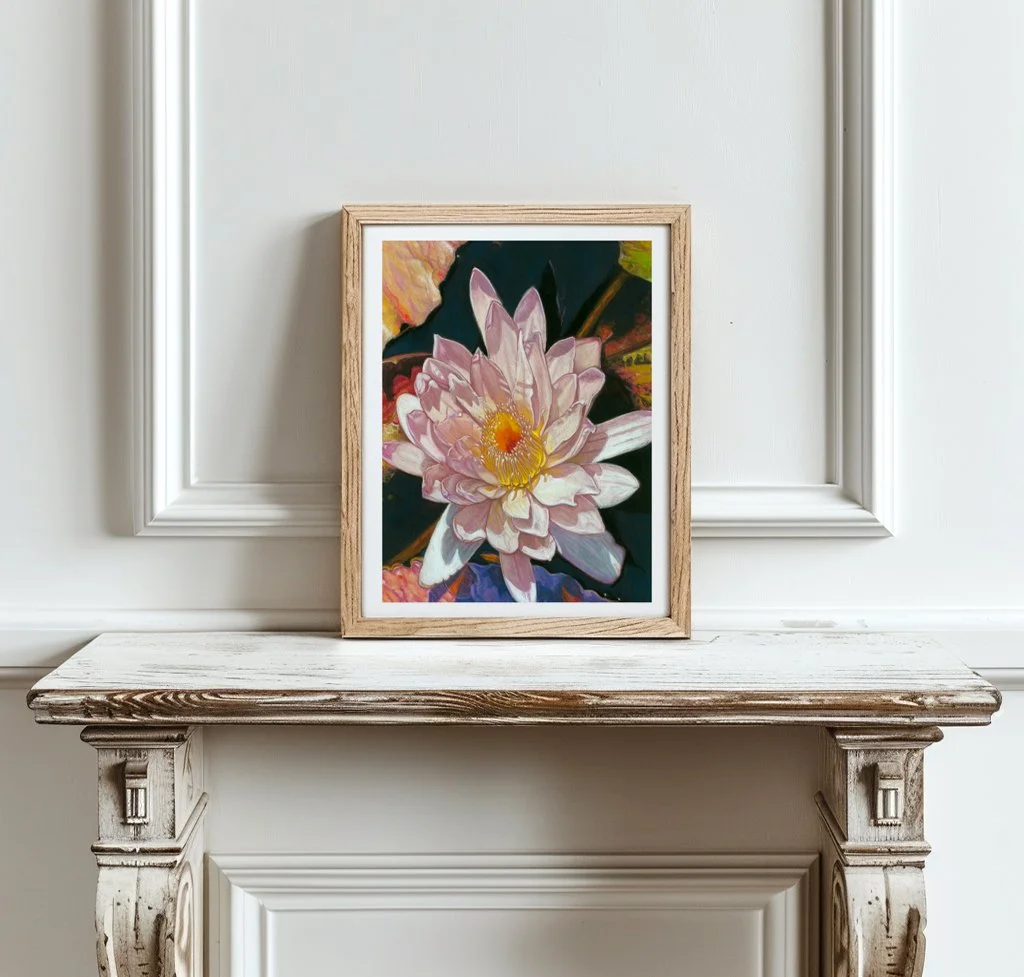 Water lily art print in a white frame resting on a carved white marble mantel