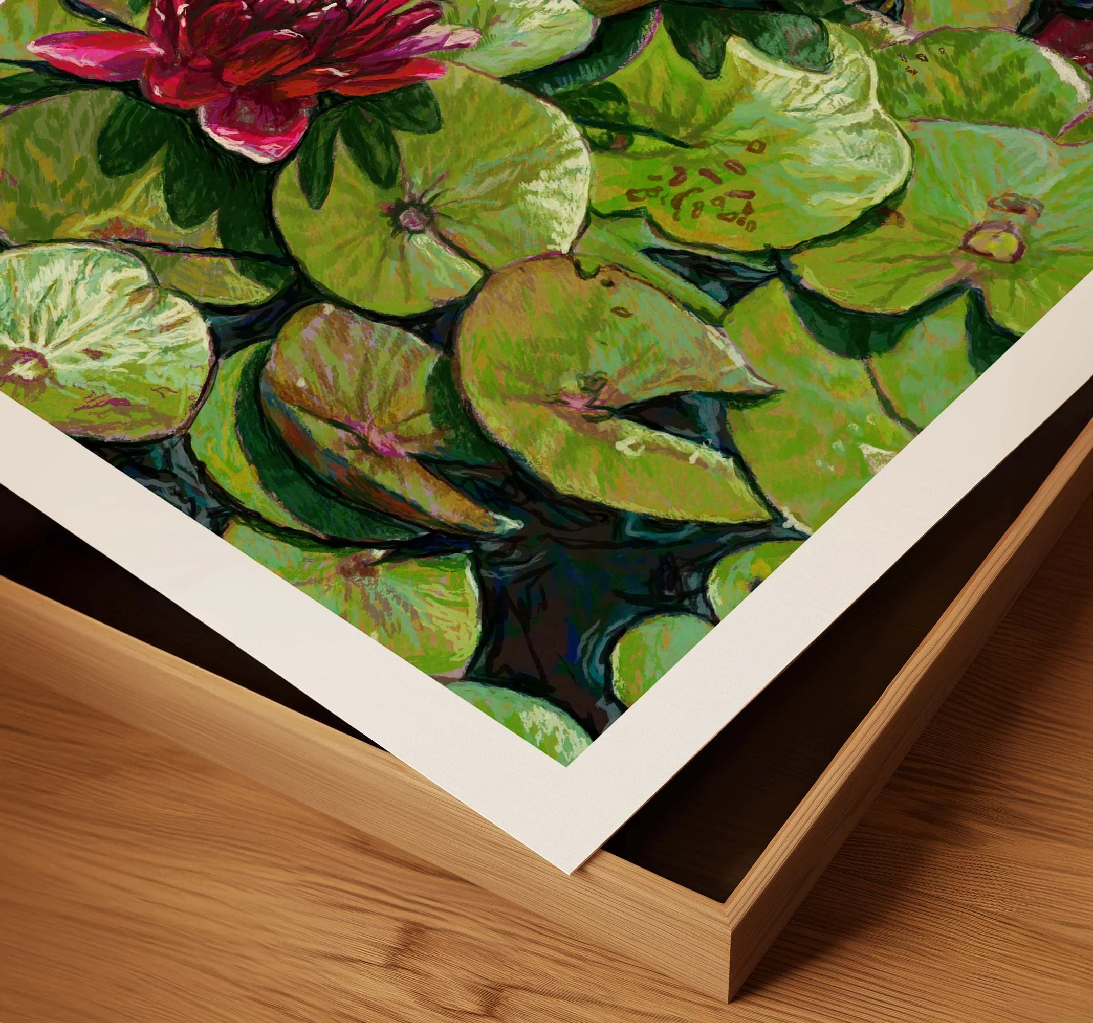 Corner detail of a framed water lily print showing the white mat and wood frame edge