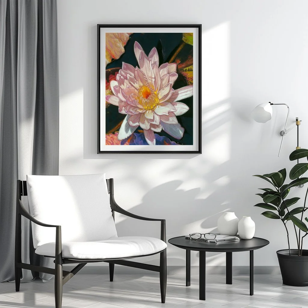 Framed white water lily print on a wall in a monochrome living room with a white chair and black side table