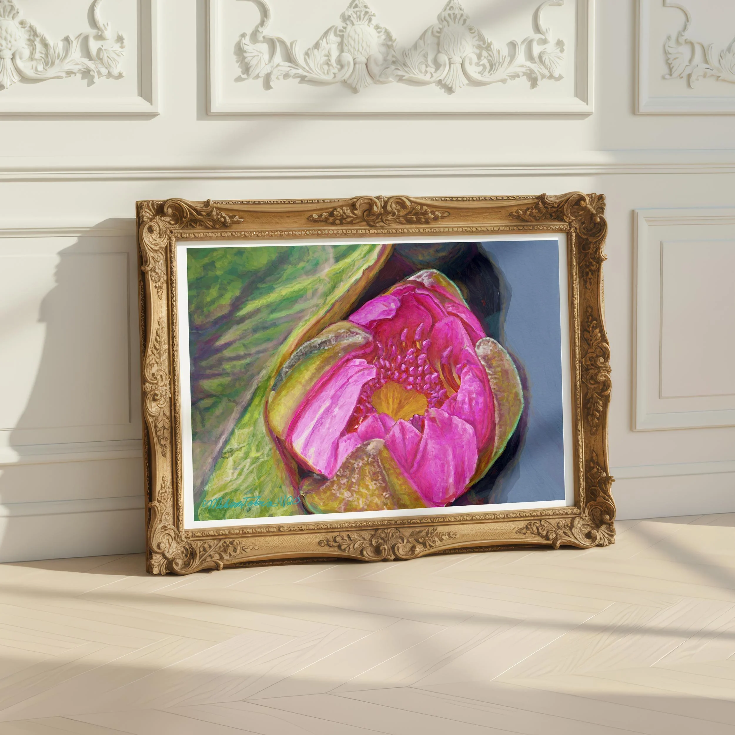 Framed pink water lily print in an ornate gold frame leaning against white paneling in soft daylight