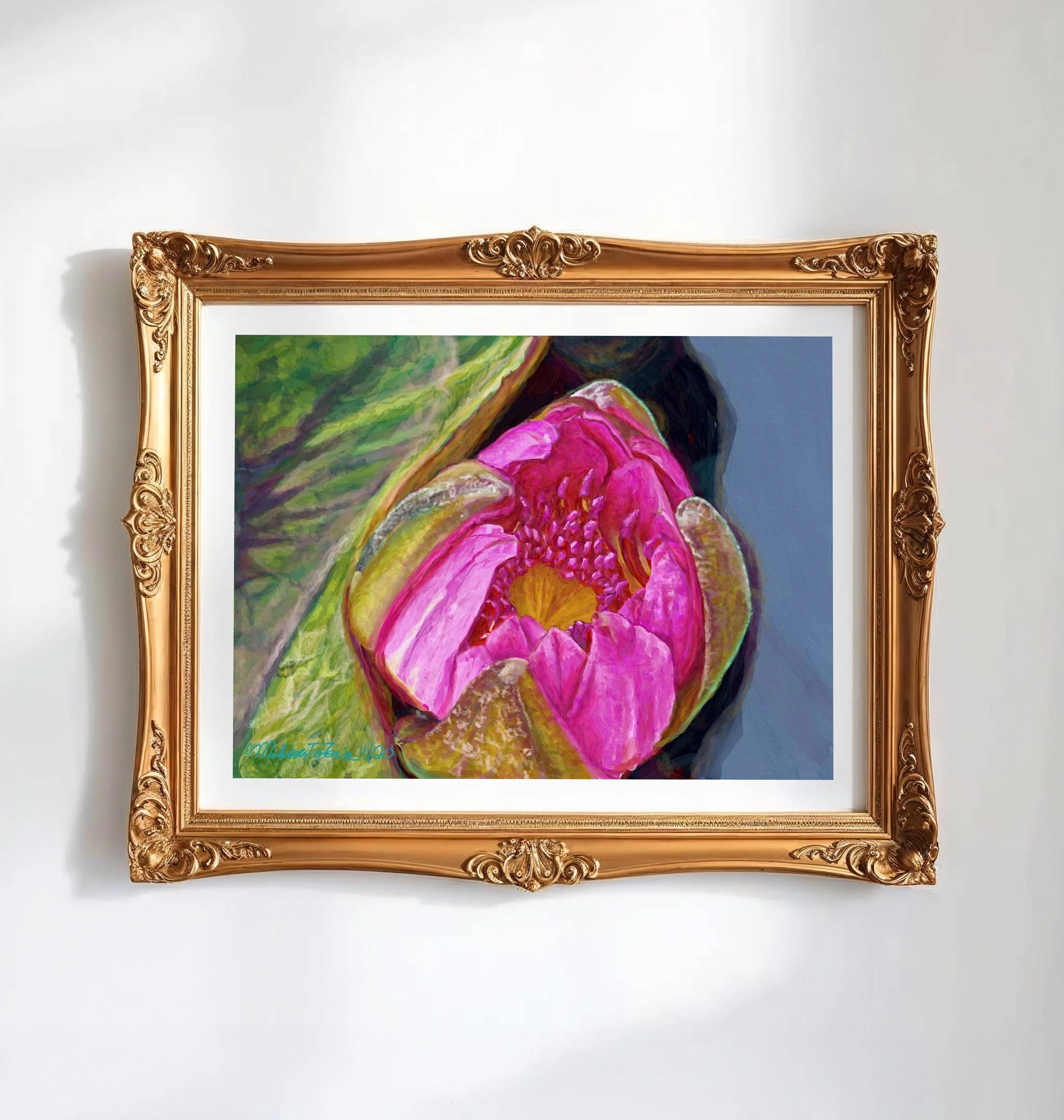 Pink water lily wall art in an ornate gold frame hung on a white wall