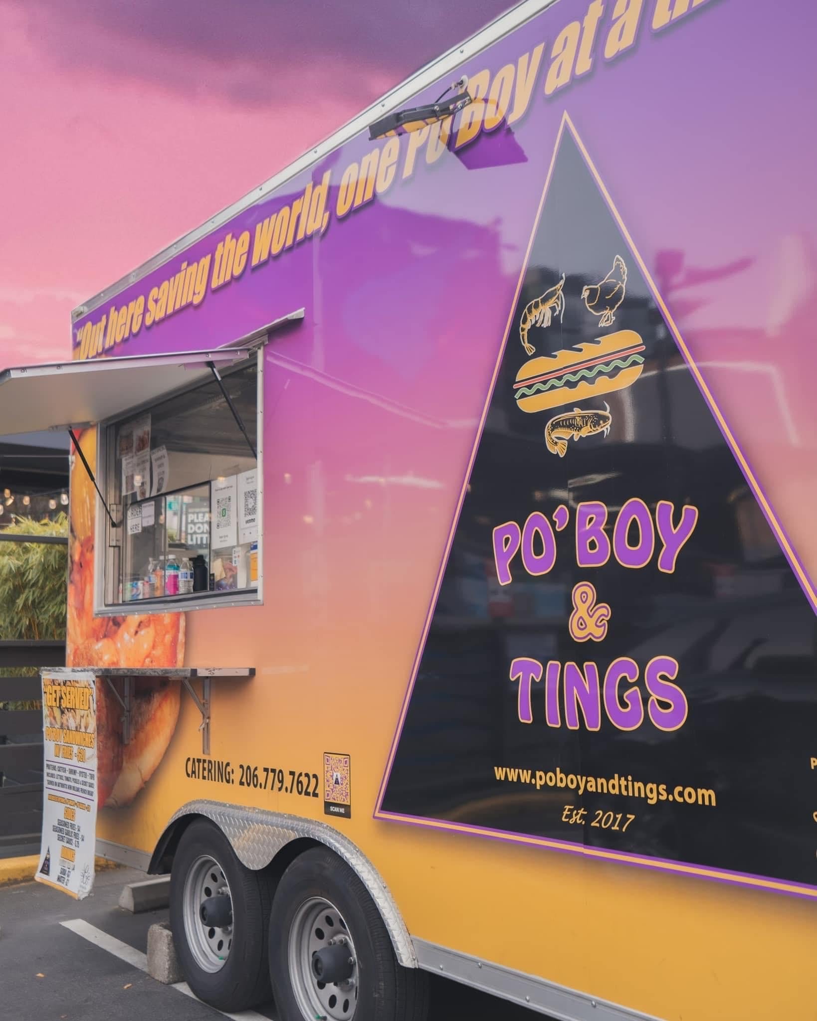 Food truck with purple and yellow branding, displaying a sign for po' boy sandwiches, chicken wings, and tings, with a window for ordering and a dessert menu outside