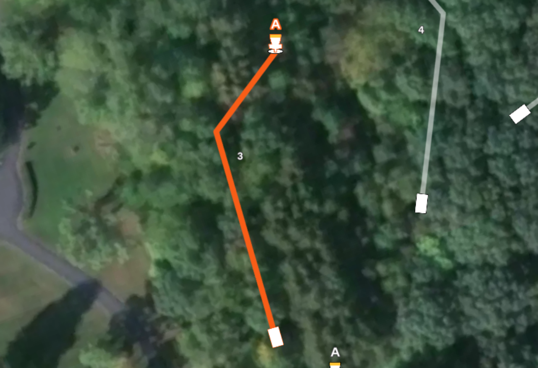 Aerial map of hole #3 at Sand Ridge Disc Golf Course. Features a wooded fairway with an orange flight path doglegging right to basket A. A portion of the fairway for hole #4 is also visible.