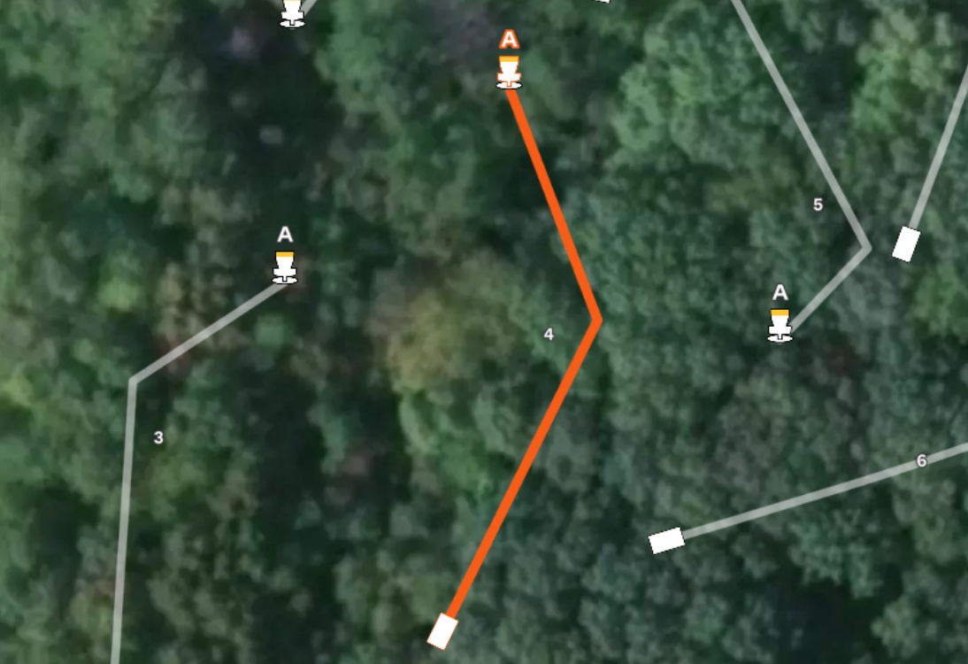 Gemini said Aerial map of hole #4 at Sand Ridge Disc Golf Course. Features a wooded fairway with an orange flight path doglegging left to basket A. Nearby holes 3, 5, and 6 are also visible.
