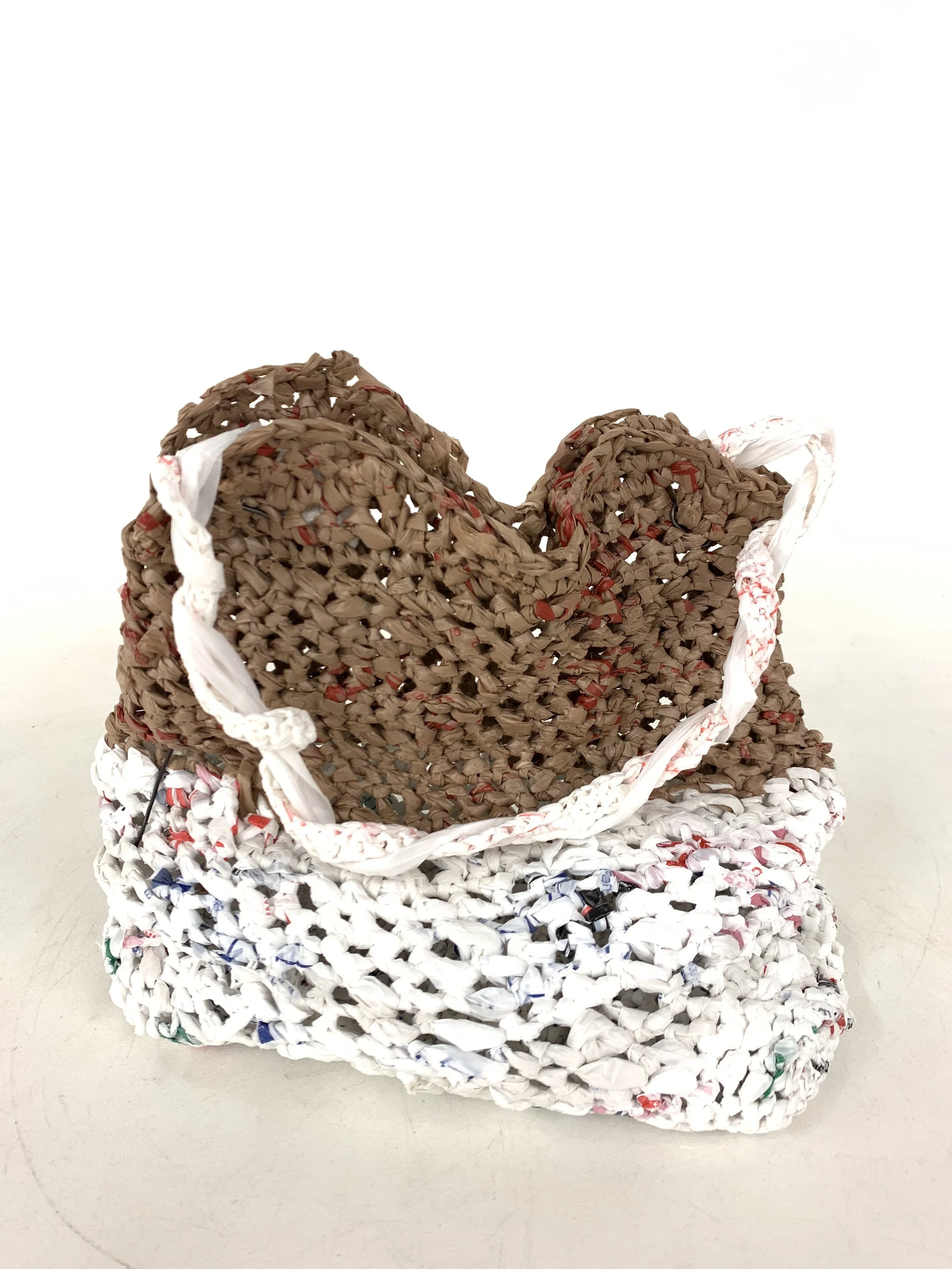A purse made out of crocheting 50+ plastic bags together.