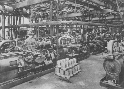 Historical photograph of people working in a factory