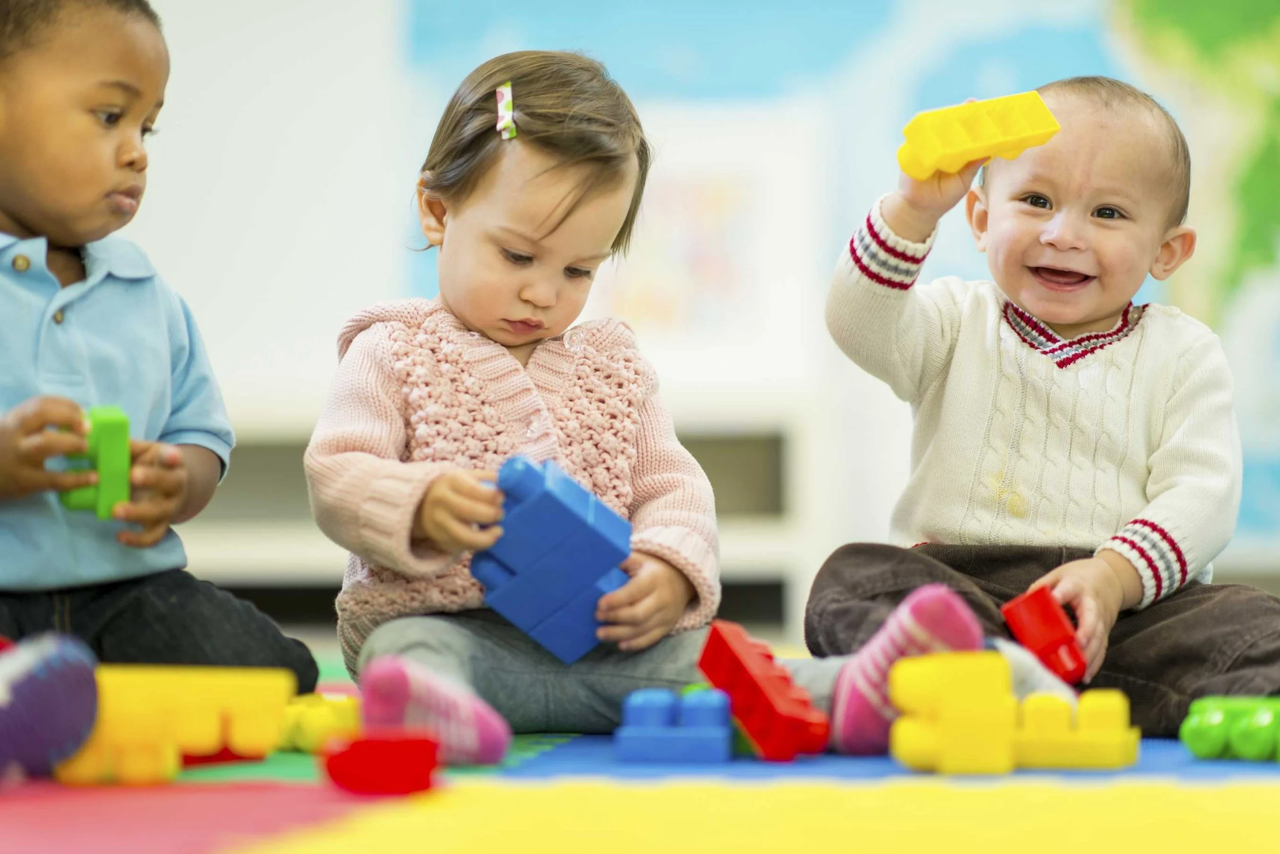 Toddlers playing at a creche session.