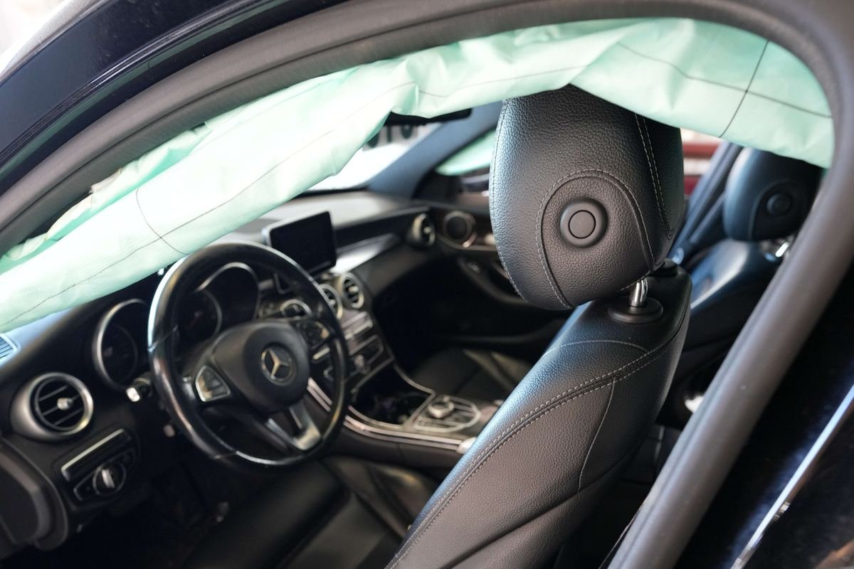 Vehicle interior with a deployed side curtain airbag
