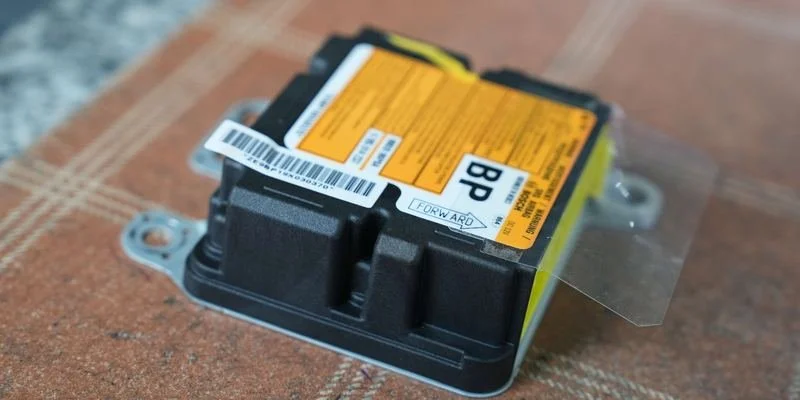 SRS airbag control module on the DNA Safety Repair bench