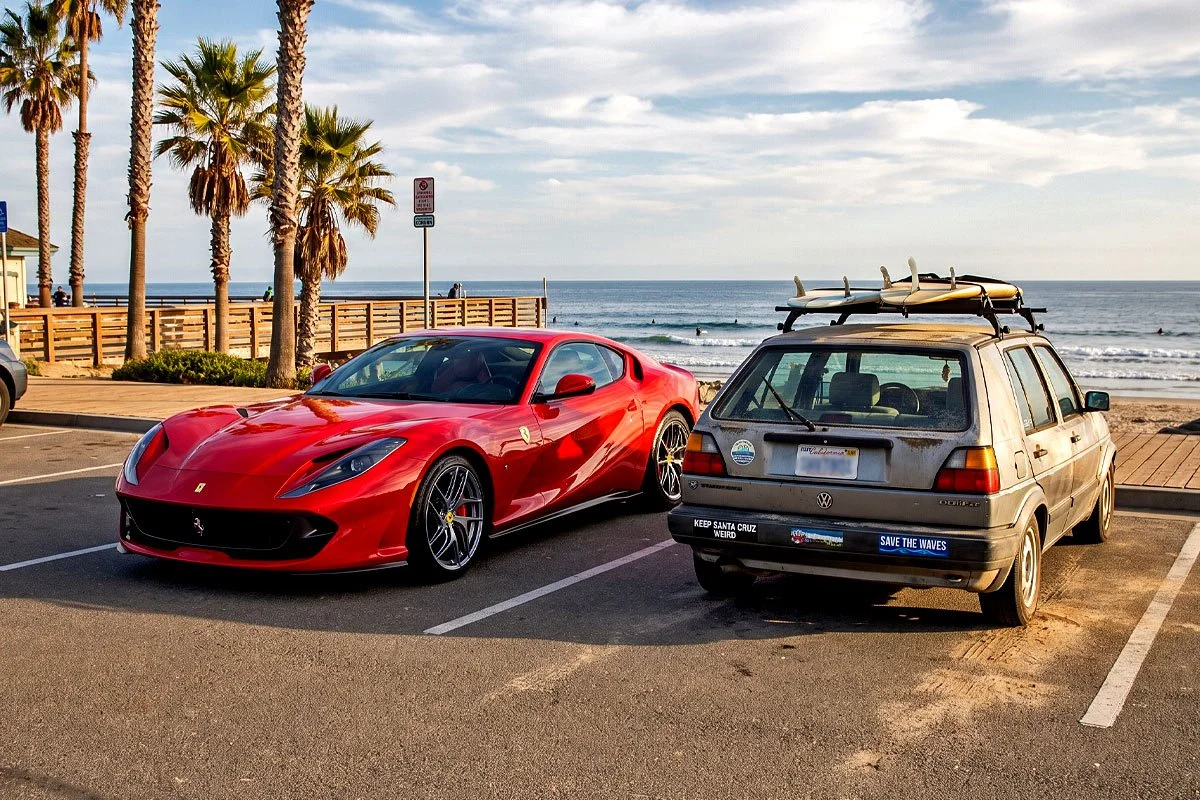 Two contrasting cars beachside in California.