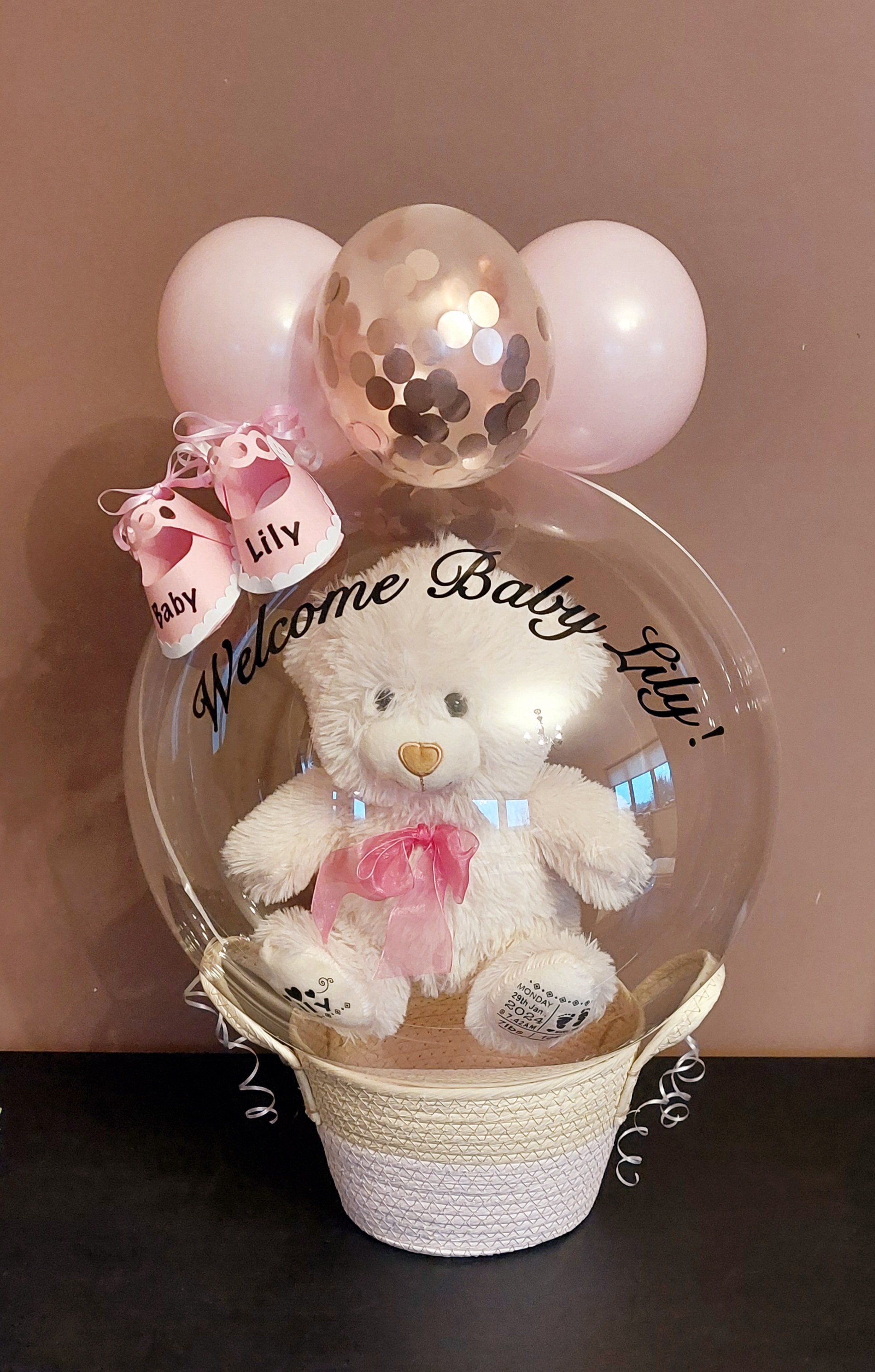 ITEM #12
€45
Personalised bubble balloon basket with personalised teddy, mini balloons and mini personalised shoes.