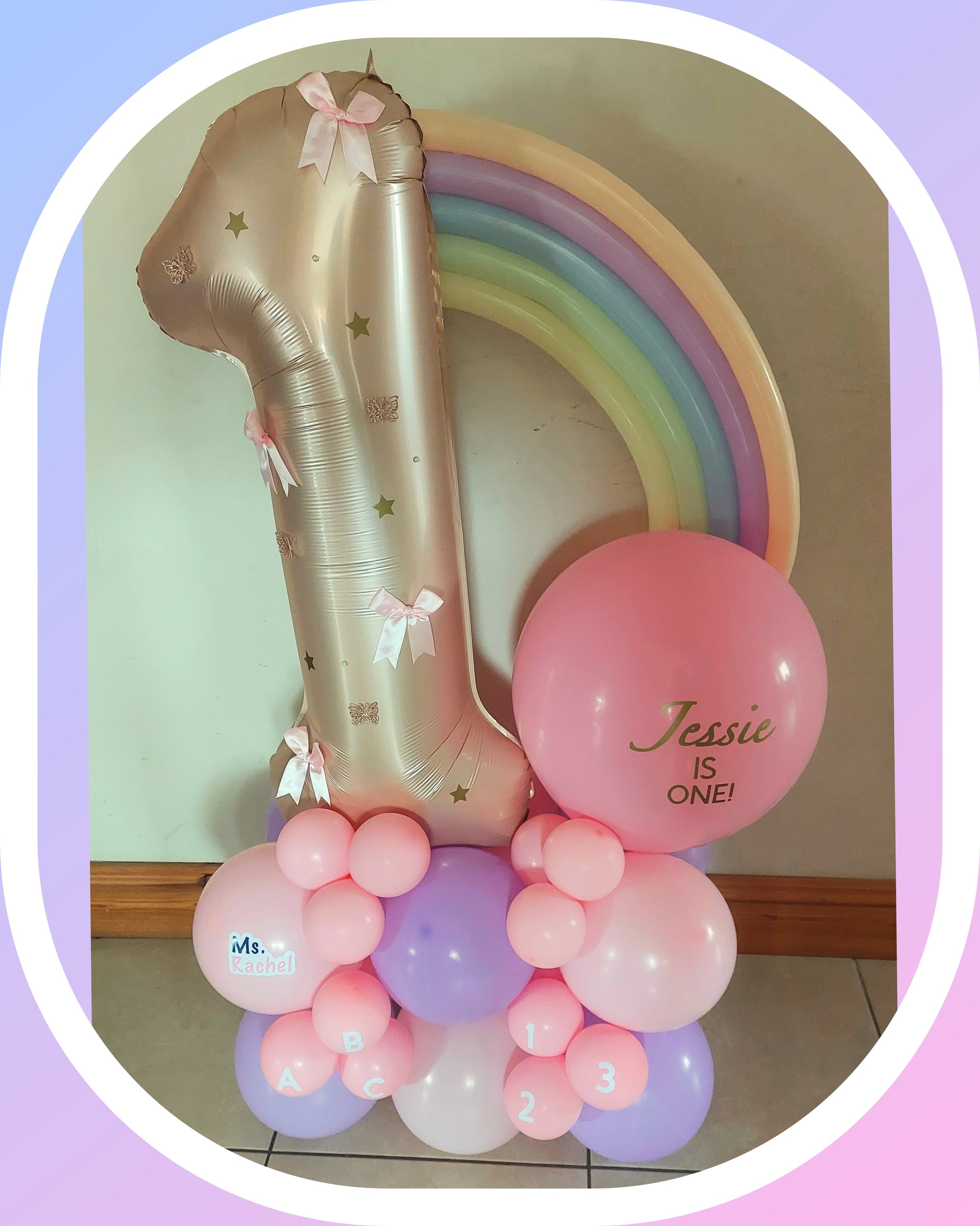 ITEM #186 --- Rainbow and bows number balloon display.