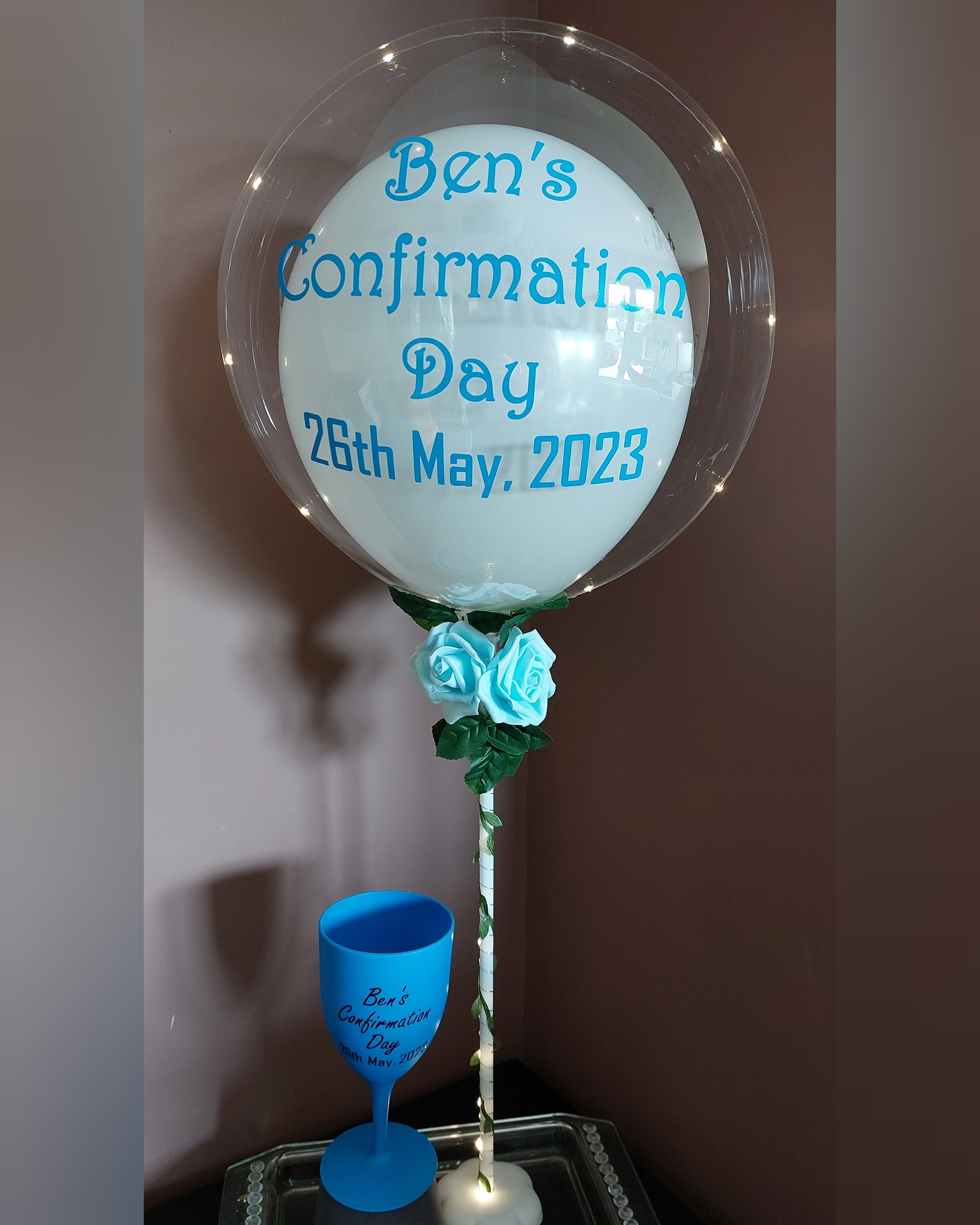 ITEM #22
SPECIAL DEAL €35!
Personalised light up balloon display with white inner balloon and blue roses. With personalised cup .